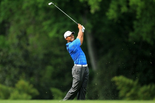 AUGUSTA, GA - APRIL 09:  Tiger Woods hits his approach shot on the fifth hole during the third round of the 2011 Masters Tournament at Augusta National Golf Club on April 9, 2011 in Augusta, Georgia.  (Photo by David Cannon/Getty Images)