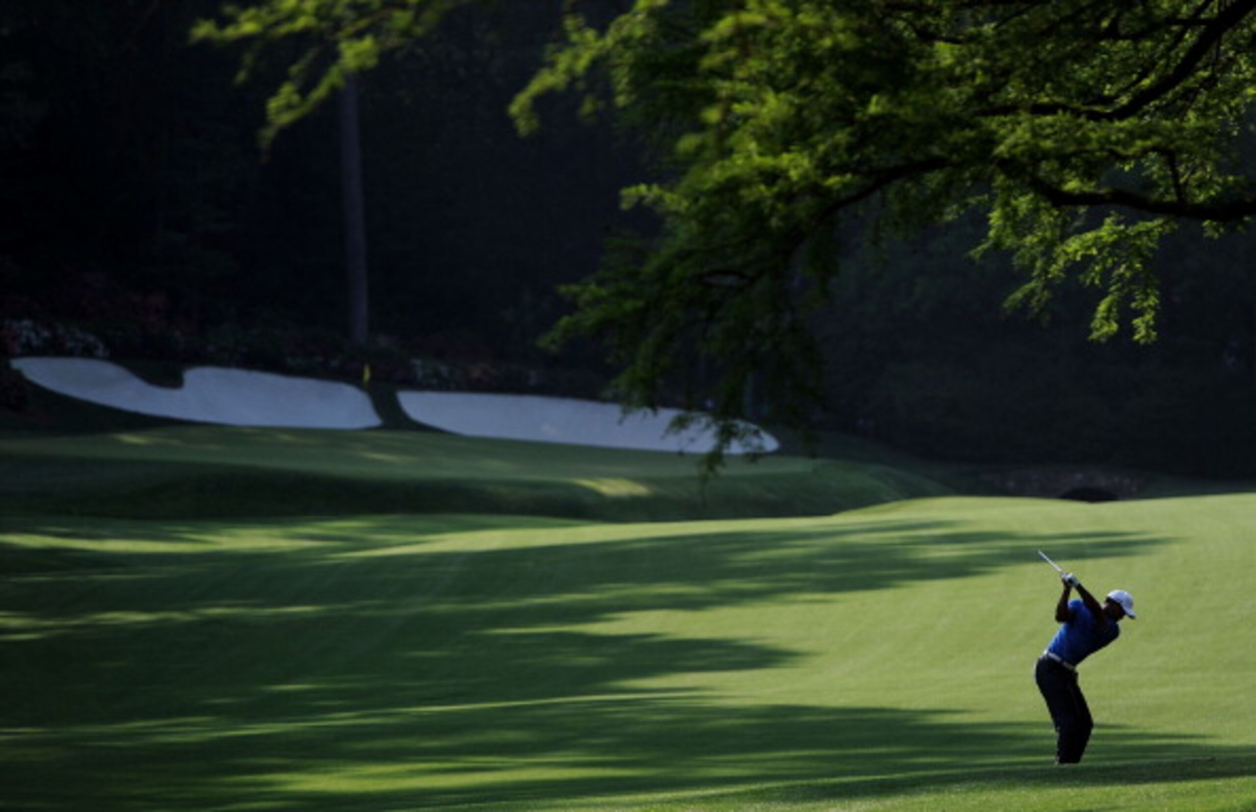 AUGUSTA, GA - APRIL 09:  Tiger Woods hits his second shot on the 13th hole during the third round of the 2011 Masters Tournament at Augusta National Golf Club on April 9, 2011 in Augusta, Georgia.  (Photo by Harry How/Getty Images)