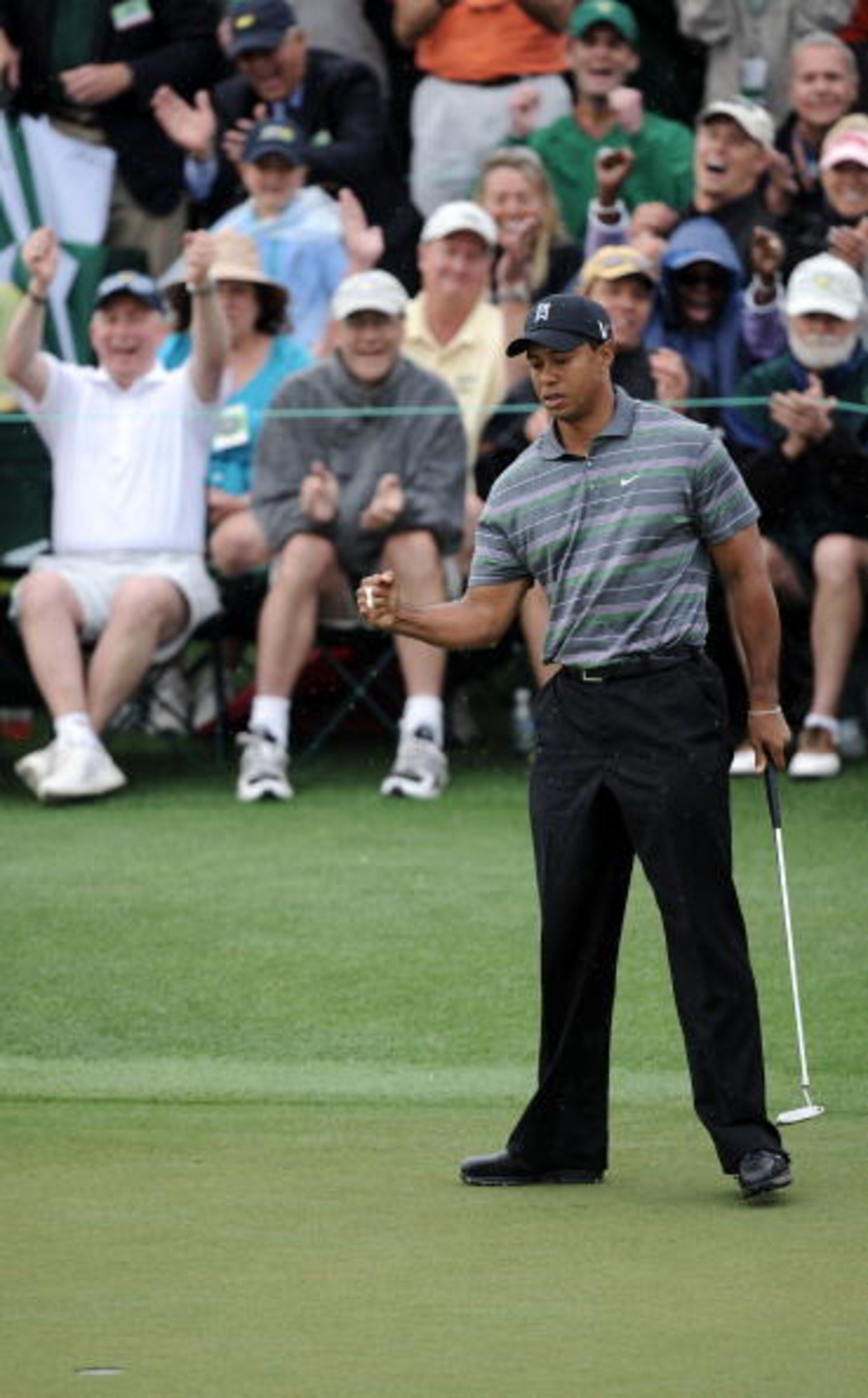 AUGUSTA, GA - APRIL 08:  Tiger Woods celebrates making birdie on the ninth hole during the first round of the 2010 Masters Tournament at Augusta National Golf Club on April 8, 2010 in Augusta, Georgia.  (Photo by Harry How/Getty Images)