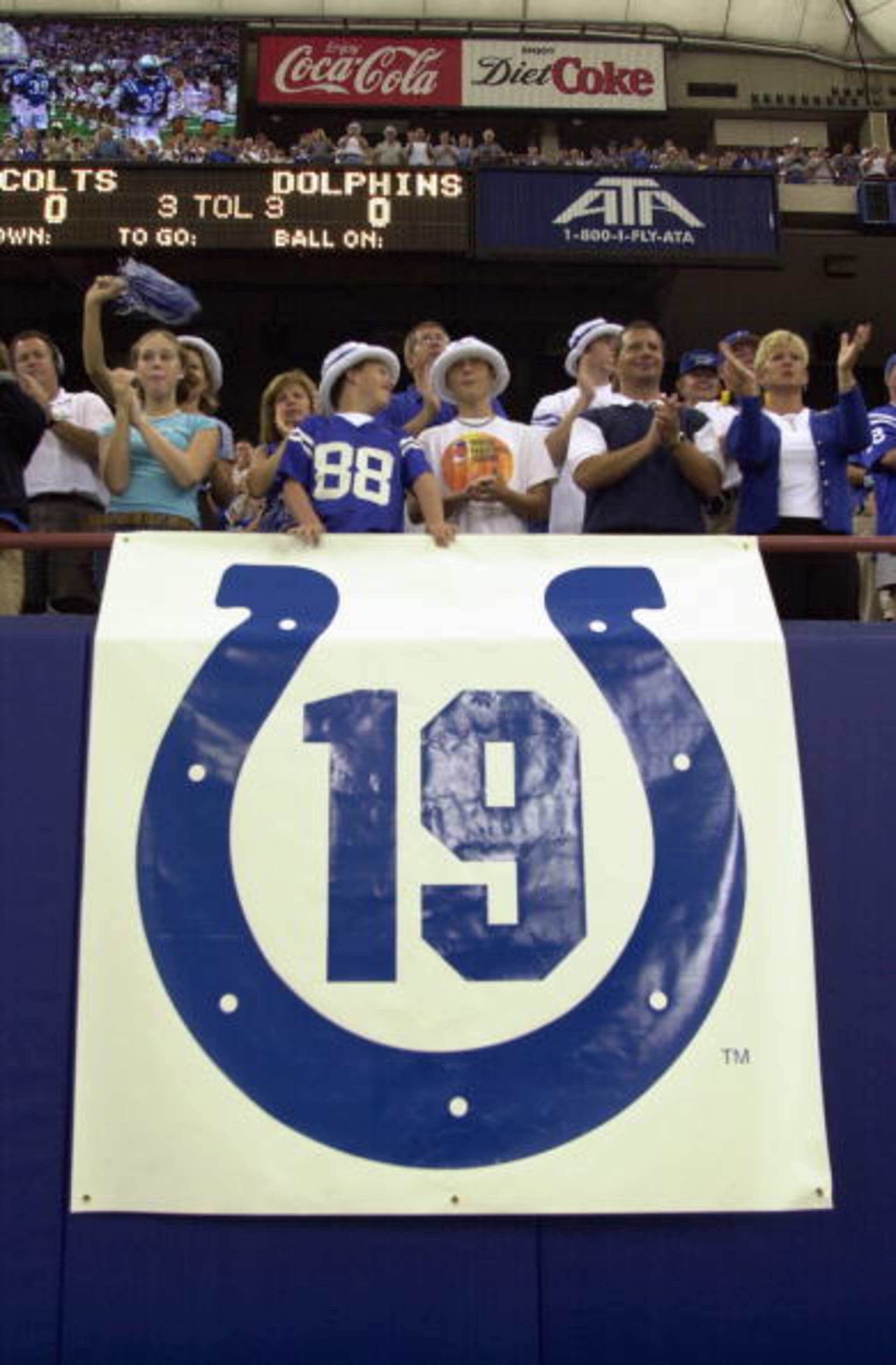 INDIANAPOLIS - SEPTEMBER 15: Fans cheer above a banner in memory of former Baltimore Colts quarterback Johnny Unitas who passed away this past week before the Indianapolis Colts take on the Miami Dolphins on September 15, 2002 at the RCA Dome in Indianap INDIANAPOLIS - SEPTEMBER 15: Fans cheer above a banner in memory of former Baltimore Colts quarterback Johnny Unitas who passed away this past week before the Indianapolis Colts take on the Miami Dolphins on September 15, 2002 at the RCA Dome in Indianap