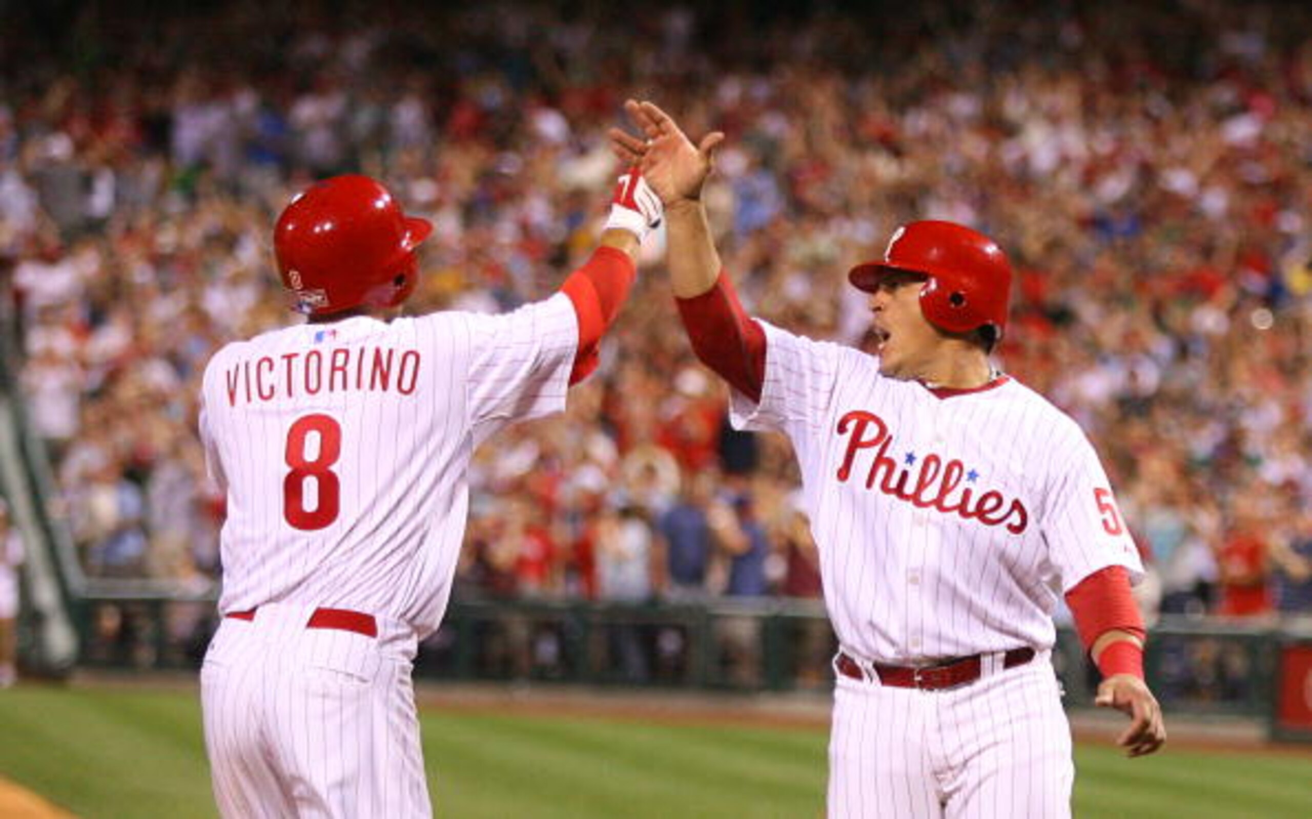 PHILADELPHIA - MAY 2: Center fielder Shane Victorino #8 of the Philadelphia Phillies is greeted by catcher Carlos Ruiz #51 after hitting a grand slam during a game against the New York Mets at Citizens Bank Park on May 2, 2010 in Philadelphia, Pennsylvani