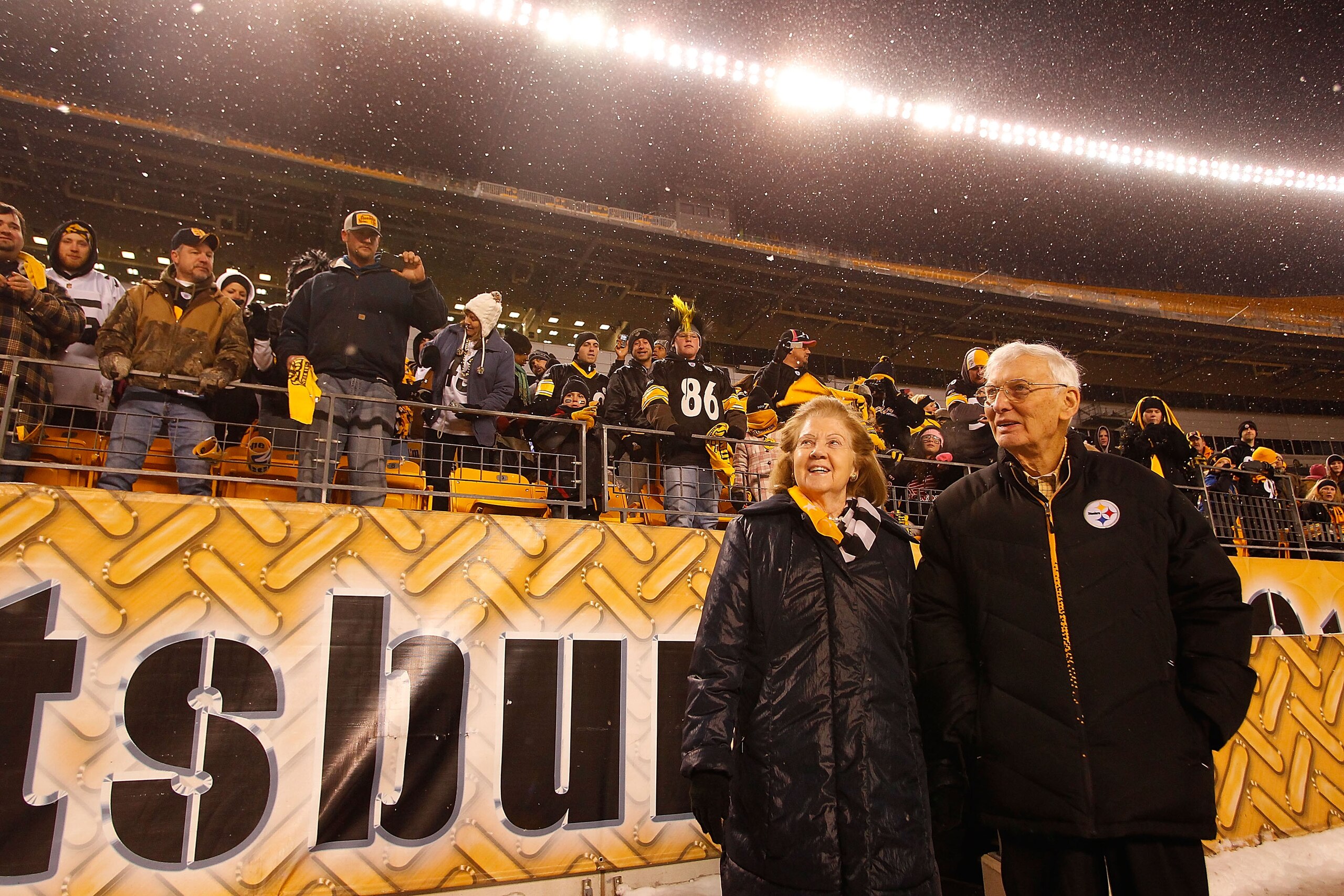 PITTSBURGH - JANUARY 28:  Owner of the Pittsburgh Steelers Dan Rooney (R) and his wife walk to the stage during the Super Bowl XLV Pep Rally on January 28, 2011 at Heinz Field in Pittsburgh, Pennsylvania.  (Photo by Jared Wickerham/Getty Images)