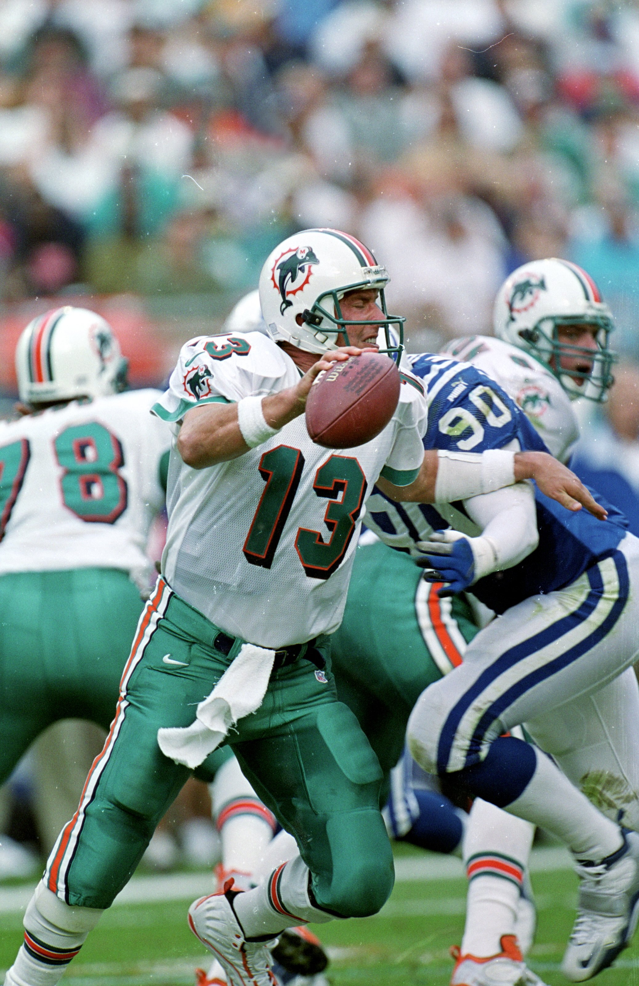 5 Dec 1999:  Dan Marino #13 of the Miami Dolphins scrambles with the ball during a game against the Indianapolis Colts at the Pro Player Stadium in Miami, Florida. The Colts defeated the Dolphins 37-34. Mandatory Credit: Eliot J. Schechter  /Allsport