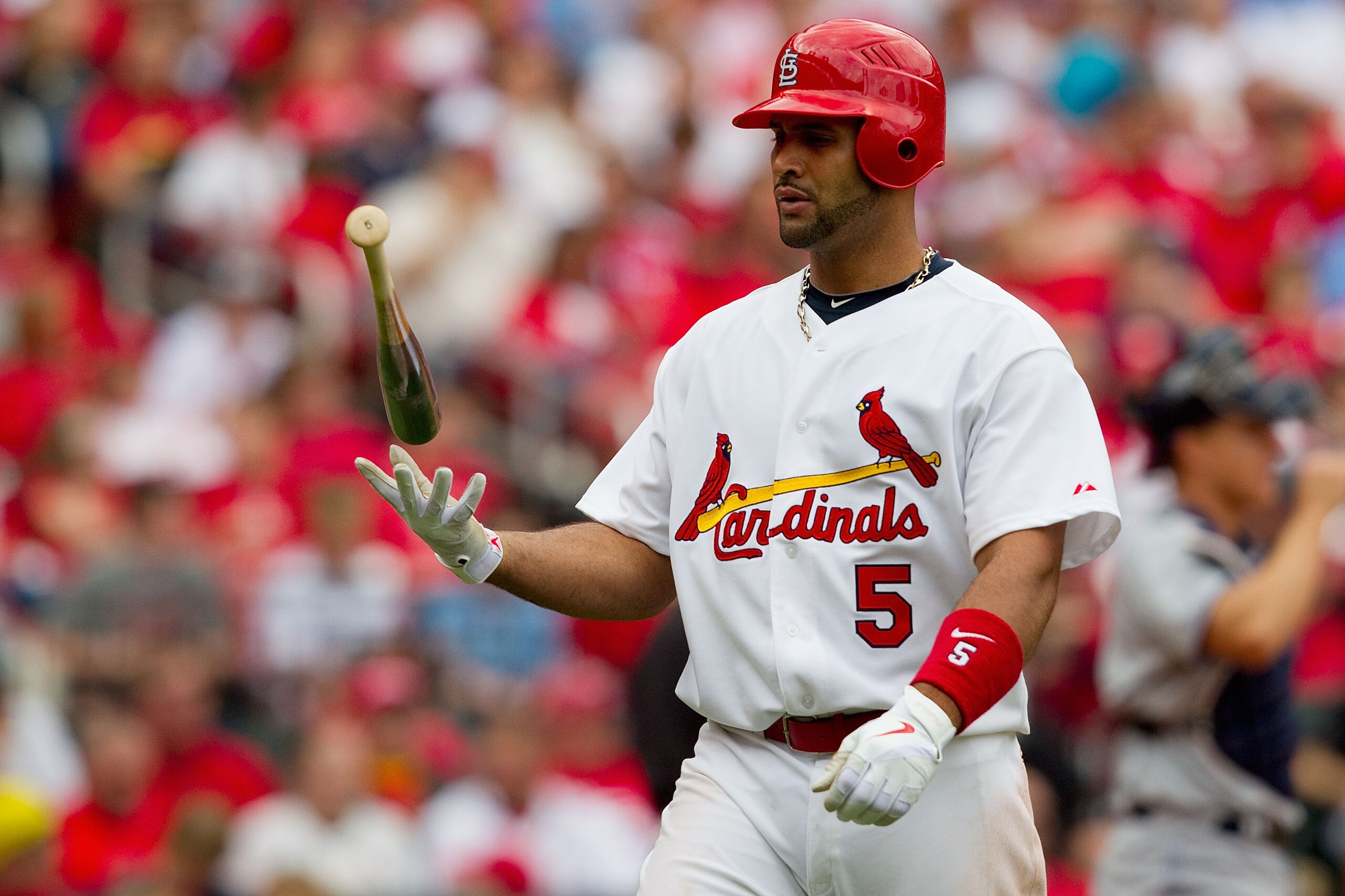 ST. LOUIS, MO - APRIL 2: Albert Pujols #5 of the St. Louis Cardinals returns to the dugout after striking out against the San Diego Padres at Busch Stadium on April 2, 2011 in St. Louis, Missouri.  (Photo by Dilip Vishwanat/Getty Images)