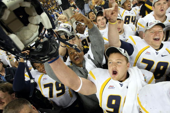 GLENDALE, AZ - JANUARY 02:  Defensive lineman Chris Neild #90 of the West Virginia Mountaineers celebrates after the Mountaineers defeated the Oklahoma Sooners 48-28 after the Tostito's Fiesta Bowl at University of Phoenix Stadium January 2, 2008 in Glend