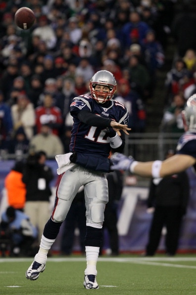 FOXBORO, MA - JANUARY 16:  Quarterback Tom Brady #12 of the New England Patriots throws a pass during their 2011 AFC divisional playoff game against the New York Jets at Gillette Stadium on January 16, 2011 in Foxboro, Massachusetts.  (Photo by Elsa/Getty