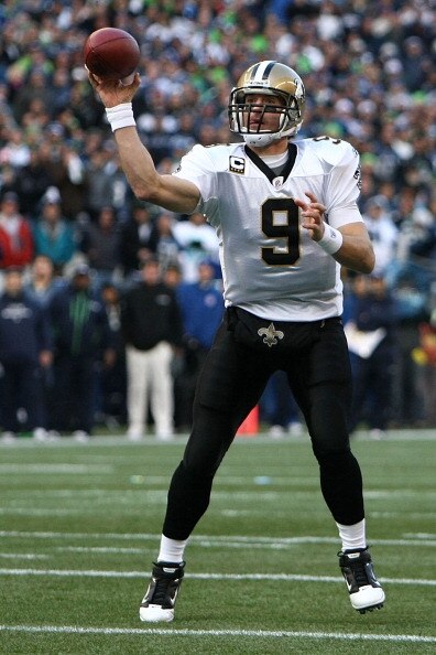 SEATTLE, WA - JANUARY 08:  Quarterback Drew Brees #9 of the New Orleans Saints throws a short pass that went incomplete in the first quarter against the Seattle Seahawks during the 2011 NFC wild-card playoff game at Qwest Field on January 8, 2011 in Seatt