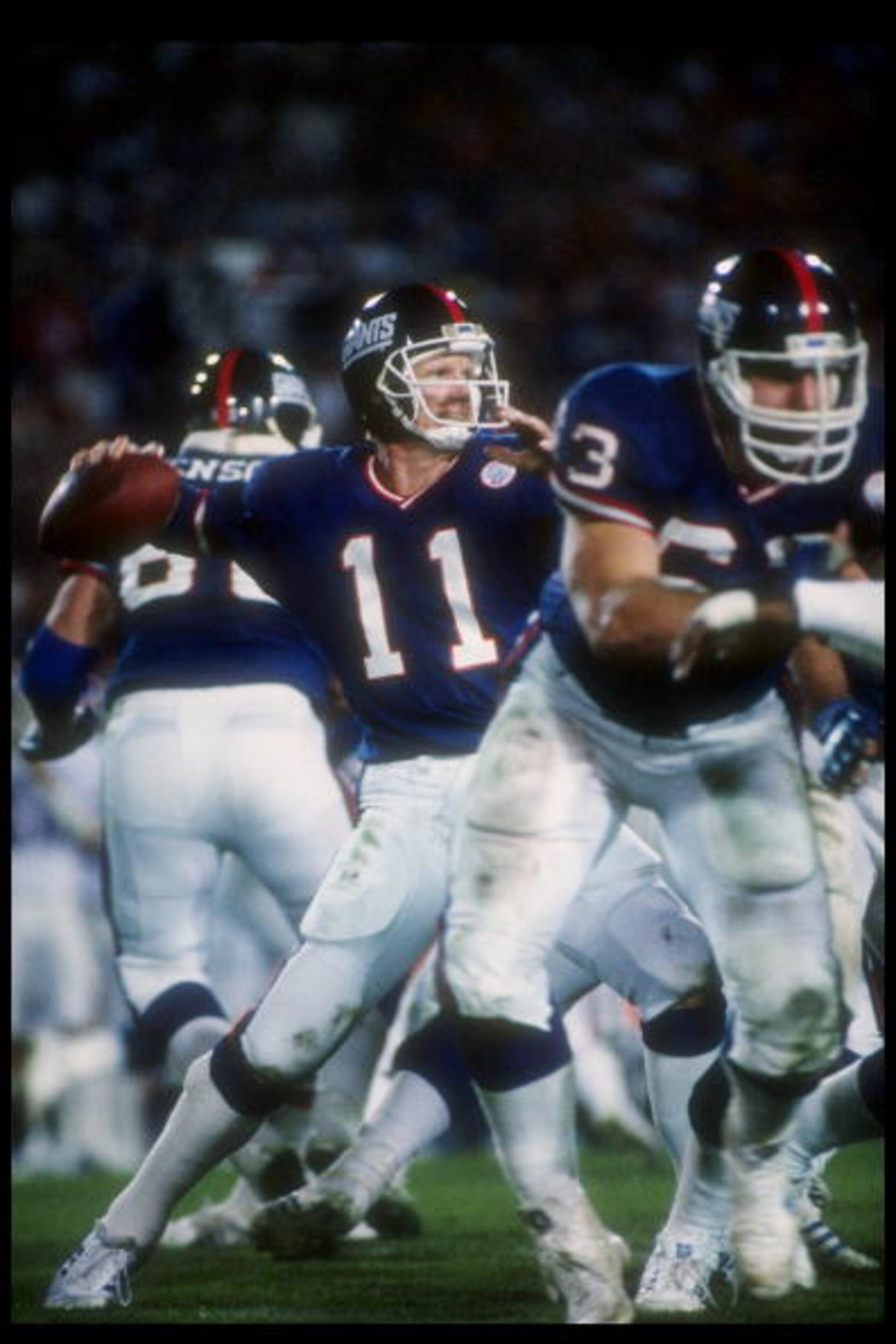 25 Jan 1987:  Quarterback Phil Simms of the New York Giants passes the ball during Super Bowl XXI against the Denver Broncos at the Rose Bowl in Pasadena, California.  The Giants won the game, 39-20. Mandatory Credit: Allsport  /Allsport
