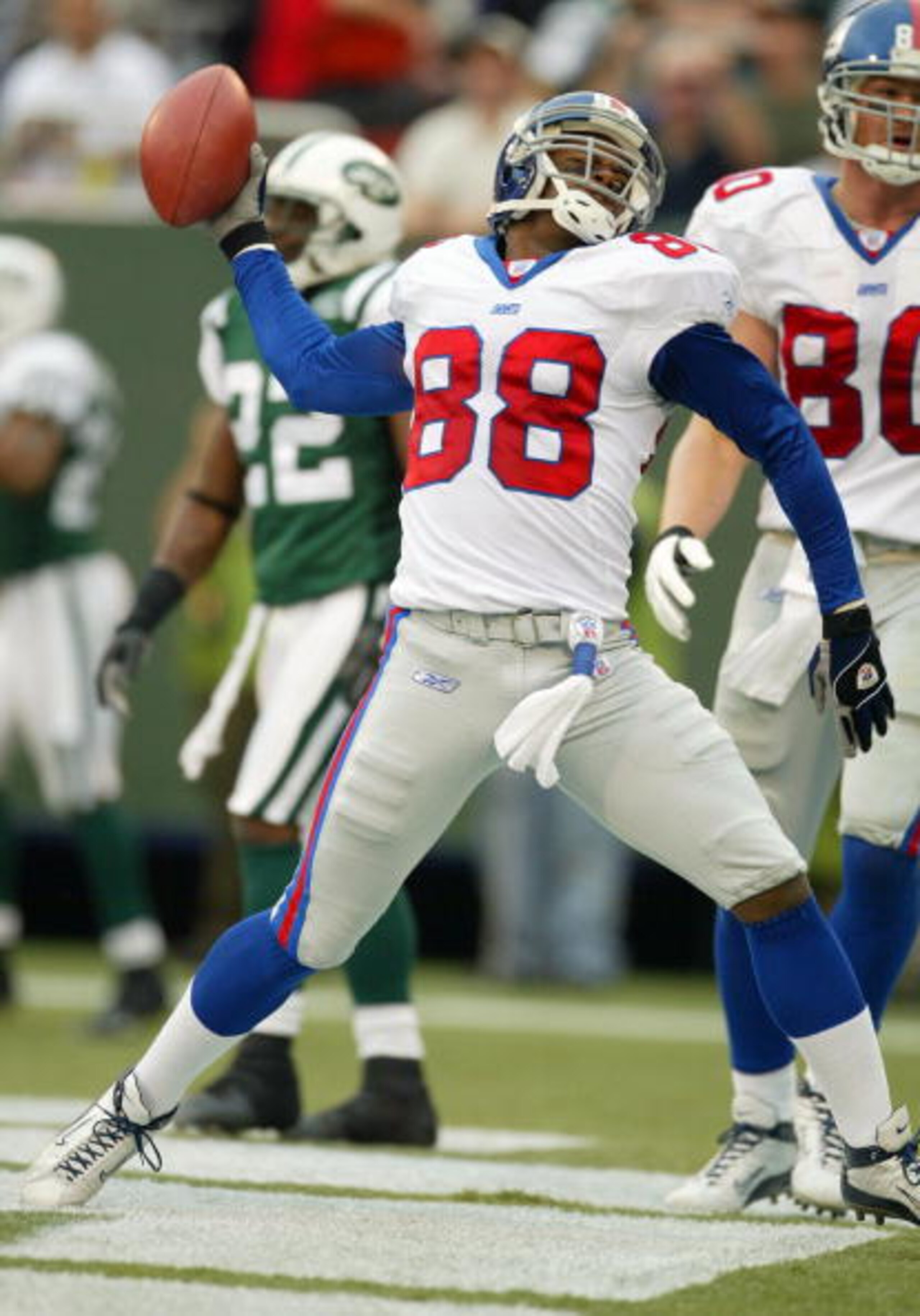 EAST RUTHERFORD, NJ - NOVEMBER 2:  Ike Hilliard #88 of the New York Giants celebrates a touchdown in the fourth quarter against the New York Jets during their game at Giants Stadium on November 2, 2003 in East Rutherford, New Jersey.  (Photo by Al Bello/G