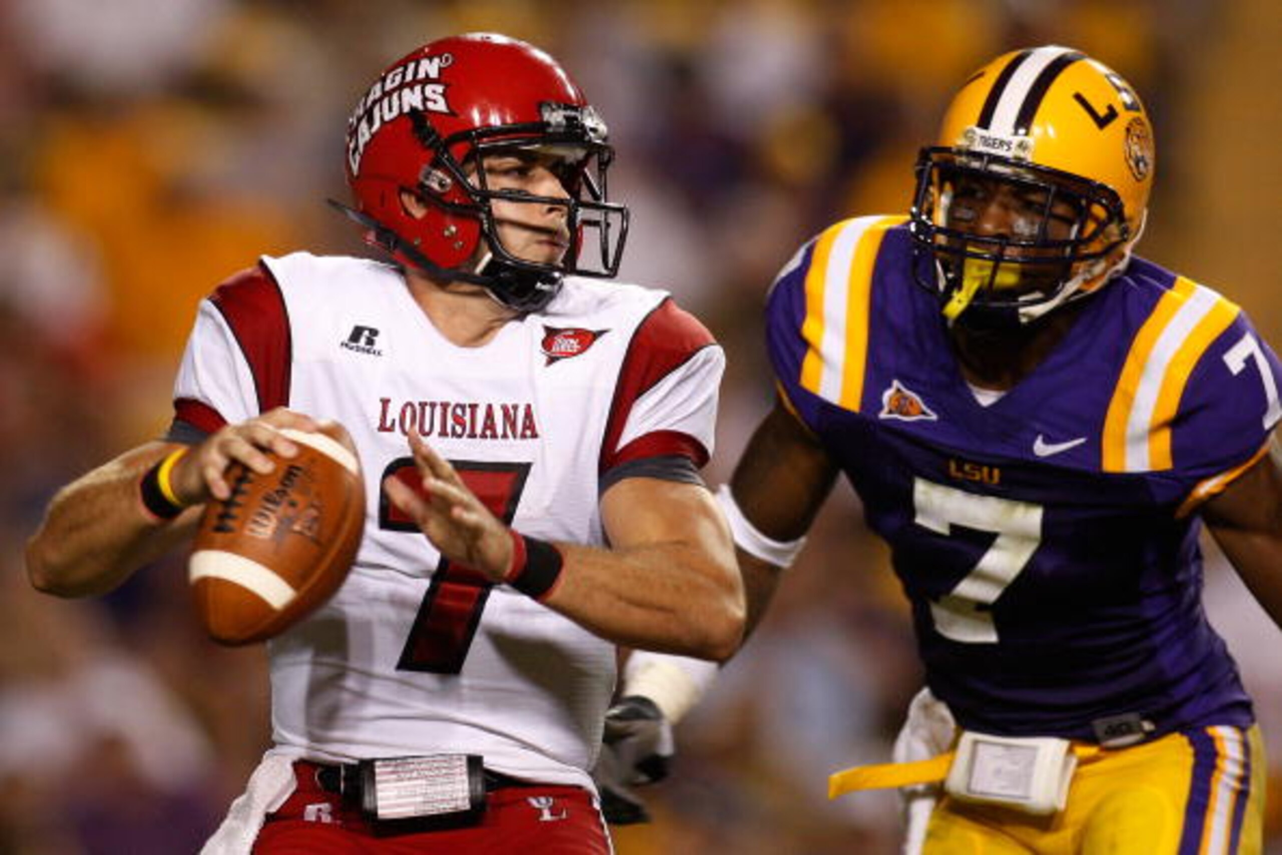 BATON ROUGE, LA - SEPTEMBER 19:  Quarterback Chris Masson #7 of the University of Louisiana-Lafatette Ragin' Cajuns looks to throw under pressure from Patrick Peterson #7 of the Louisiana State University Tigers at Tiger Stadium on September 19, 2009 in B