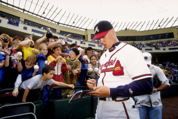 28 Feb 1998:  Chipper Jones #10 of the Atlanta Braves signs autographs for fans during a spring training game against the New York Mets at the Disney Wide World of Sports Stadium in Orlando, Florida. The Braves defeated the Mets 3-2. Mandatory Credit: And