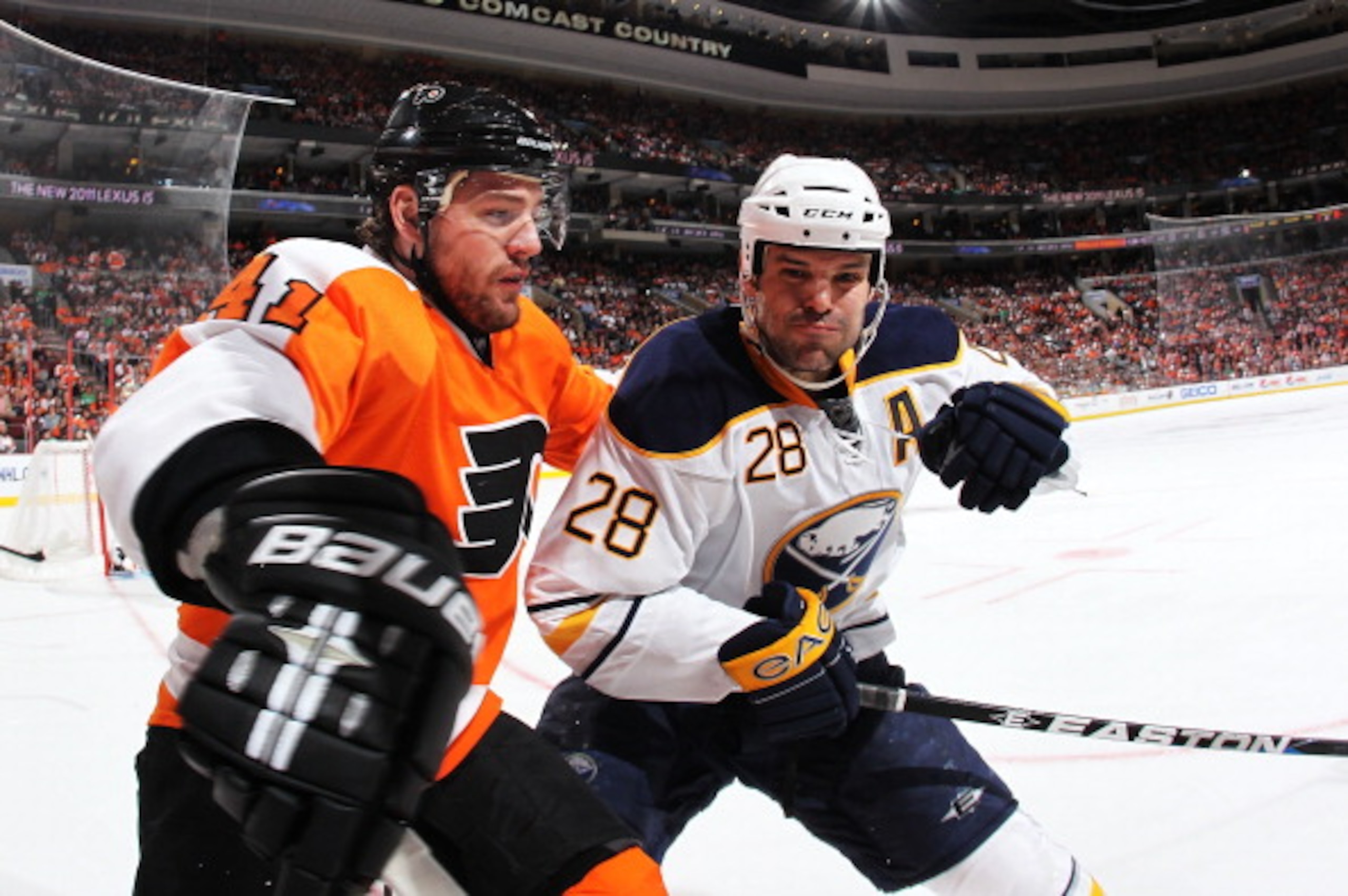 PHILADELPHIA - MARCH 05:  Paul Gaustad #28 of the Buffalo Sabres checks Andrej Meszaros #41 of The Philadelphia Flyers during their game on March 5, 2011 at The Wells Fargo Center in Philadelphia, Pennsylvania.  (Photo by Al Bello/Getty Images)