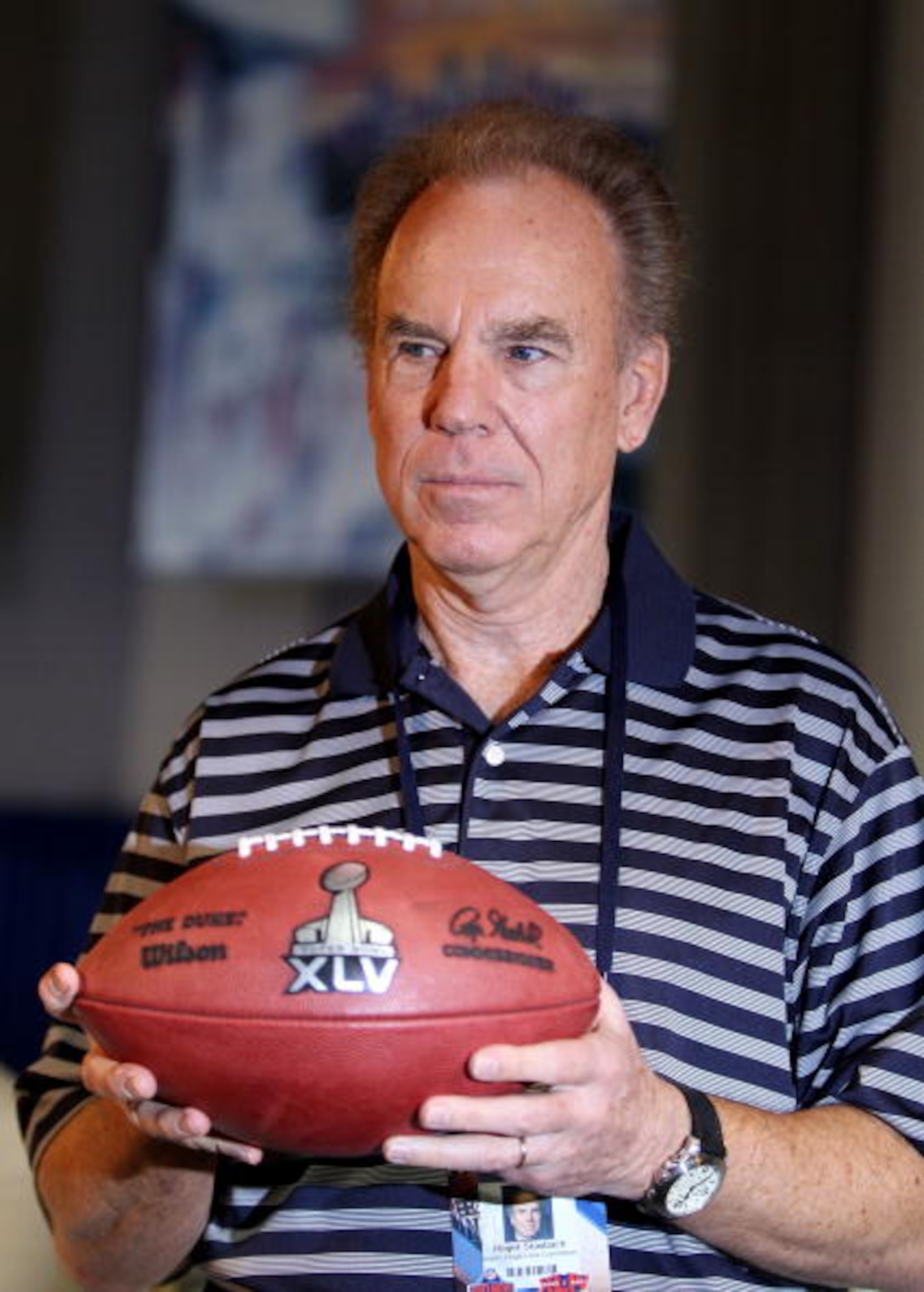 FORT LAUDERDALE, FL - FEBRUARY 04: Roger Staubach, former NFL quarterback, holds a football with the new Super Bowl logo during a press conference held at the Fort Lauderdale Convention Center as part of media week for Super Bowl XLIV on February 4, 2010 FORT LAUDERDALE, FL - FEBRUARY 04: Roger Staubach, former NFL quarterback, holds a football with the new Super Bowl logo during a press conference held at the Fort Lauderdale Convention Center as part of media week for Super Bowl XLIV on February 4, 2010