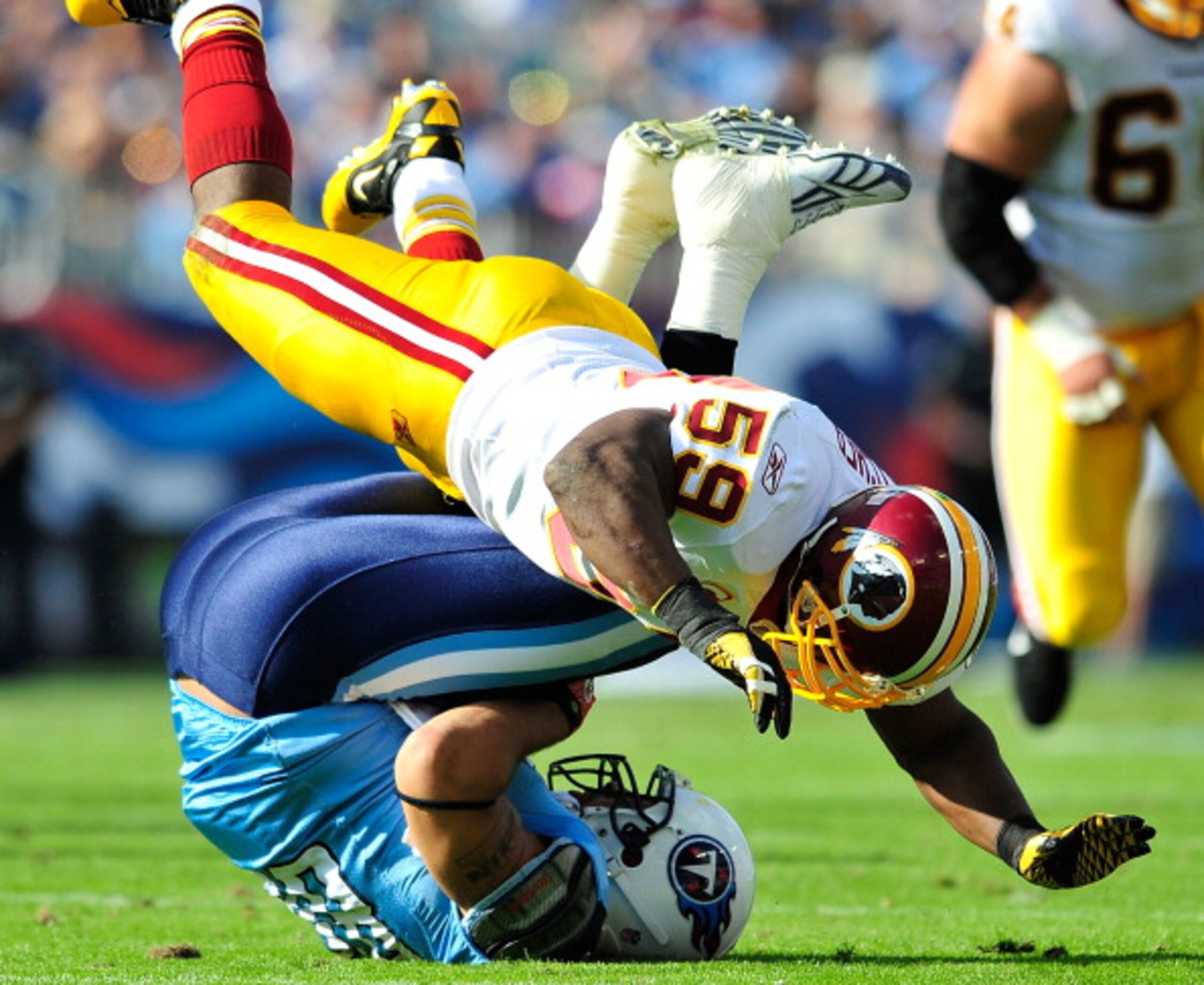 NASHVILLE, TN - NOVEMBER 21:  London Fletcher #59 of the Washington Redskins tackles Chris Johnson #28 of the Tennessee Titans during the first half at LP Field on November 21, 2010 in Nashville, Tennessee.  (Photo by Grant Halverson/Getty Images)