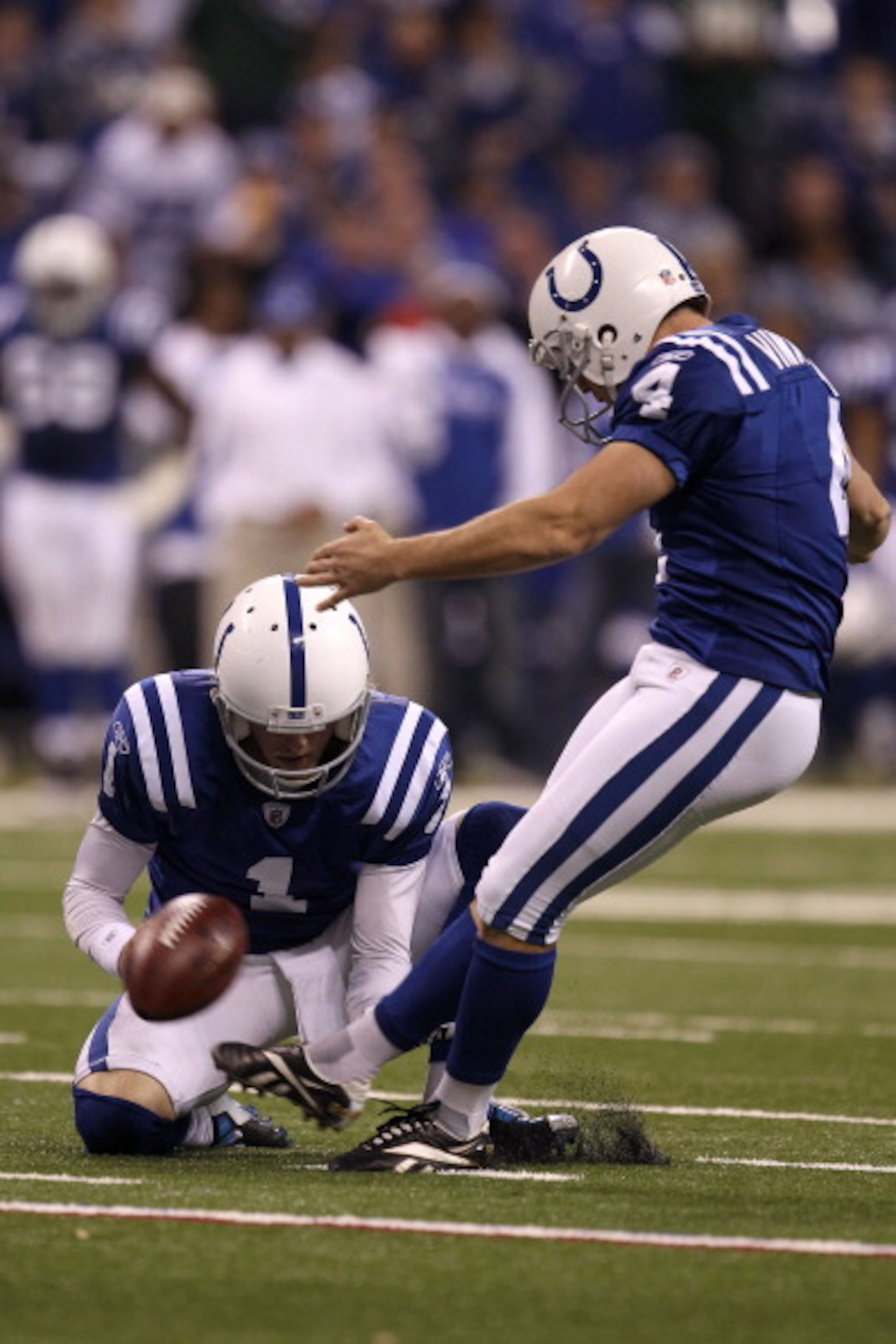 INDIANAPOLIS, IN - JANUARY 08:  Adam Vinatieri #4 of the Indianapolis Colts kicks a successful 32-yard field goal in the fourth quarter against the New York Jets during their 2011 AFC wild card playoff game at Lucas Oil Stadium on January 8, 2011 in India