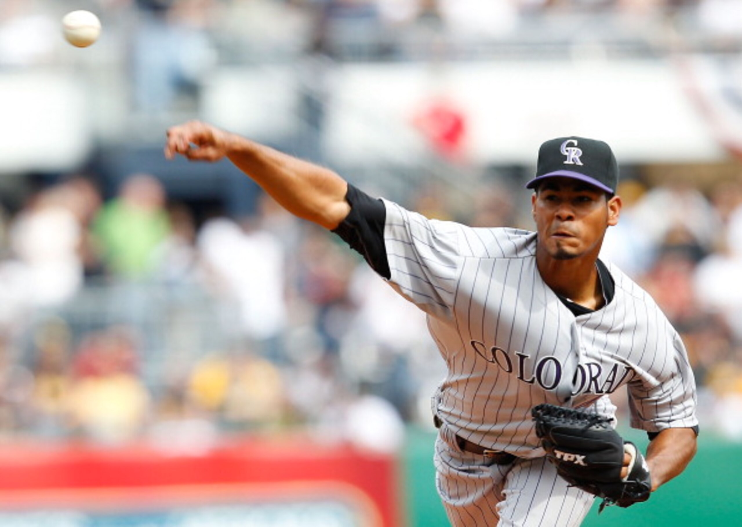 PITTSBURGH - APRIL 07:  Esmil Rogers #48 of the Colorado Rockies pitches against the Pittsburgh Pirates during the Opening Day game on April 7, 2011 at PNC Park in Pittsburgh, Pennsylvania.  (Photo by Jared Wickerham/Getty Images)