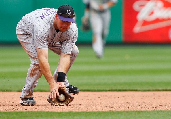 PITTSBURGH - APRIL 07:  Ty Wigginton #21 of the Colorado Rockies fields a ground ball against the Pittsburgh Pirates during the Opening Day game on April 7, 2011 at PNC Park in Pittsburgh, Pennsylvania.  (Photo by Jared Wickerham/Getty Images)