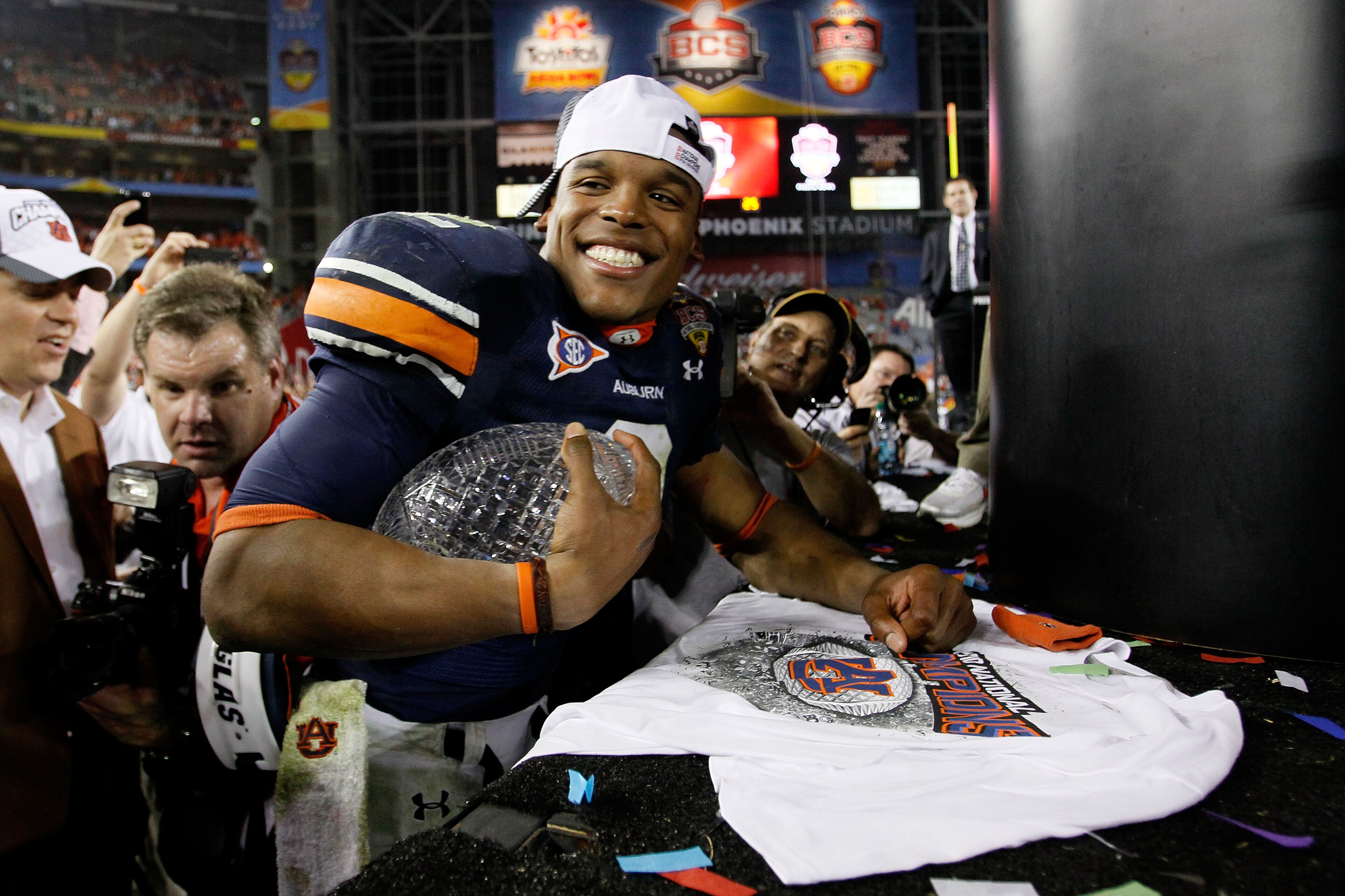 GLENDALE, AZ - JANUARY 10: Quarterback Cameron Newton #2 of the Auburn Tigers celebrates the Tigers 22-19 victory against the Oregon Ducks in the Tostitos BCS National Championship Game at University of Phoenix Stadium on January 10, 2011 in Glendale, Ar GLENDALE, AZ - JANUARY 10: Quarterback Cameron Newton #2 of the Auburn Tigers celebrates the Tigers 22-19 victory against the Oregon Ducks in the Tostitos BCS National Championship Game at University of Phoenix Stadium on January 10, 2011 in Glendale, Ar