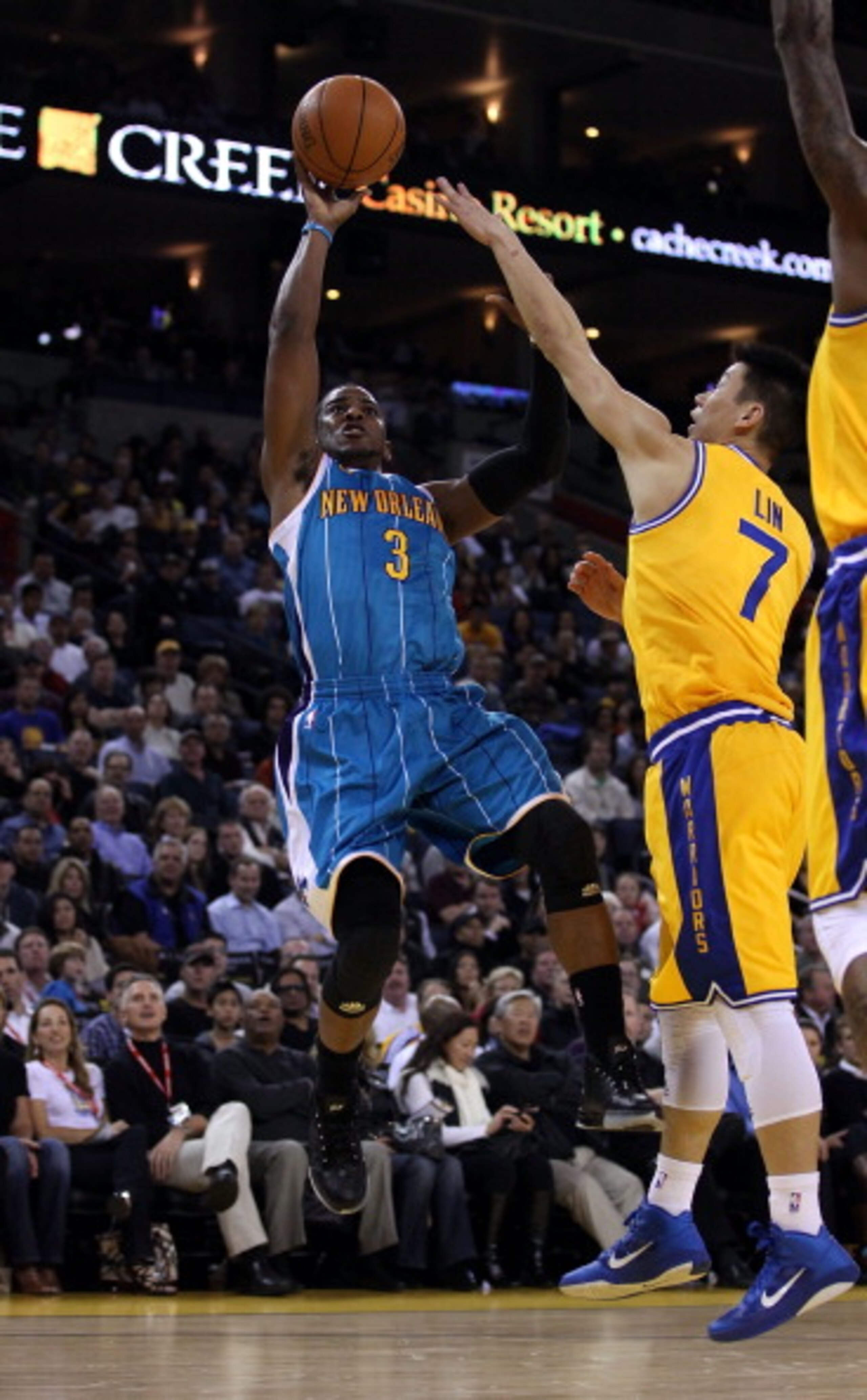OAKLAND, CA - FEBRUARY 15: Chris Paul #3 of the New Orleans Hornets shoots over Jeremy Lin #7 of the Golden State Warriors at Oracle Arena on February 15, 2011 in Oakland, California. NOTE TO USER: User expressly acknowledges and agrees that, by download OAKLAND, CA - FEBRUARY 15: Chris Paul #3 of the New Orleans Hornets shoots over Jeremy Lin #7 of the Golden State Warriors at Oracle Arena on February 15, 2011 in Oakland, California. NOTE TO USER: User expressly acknowledges and agrees that, by download