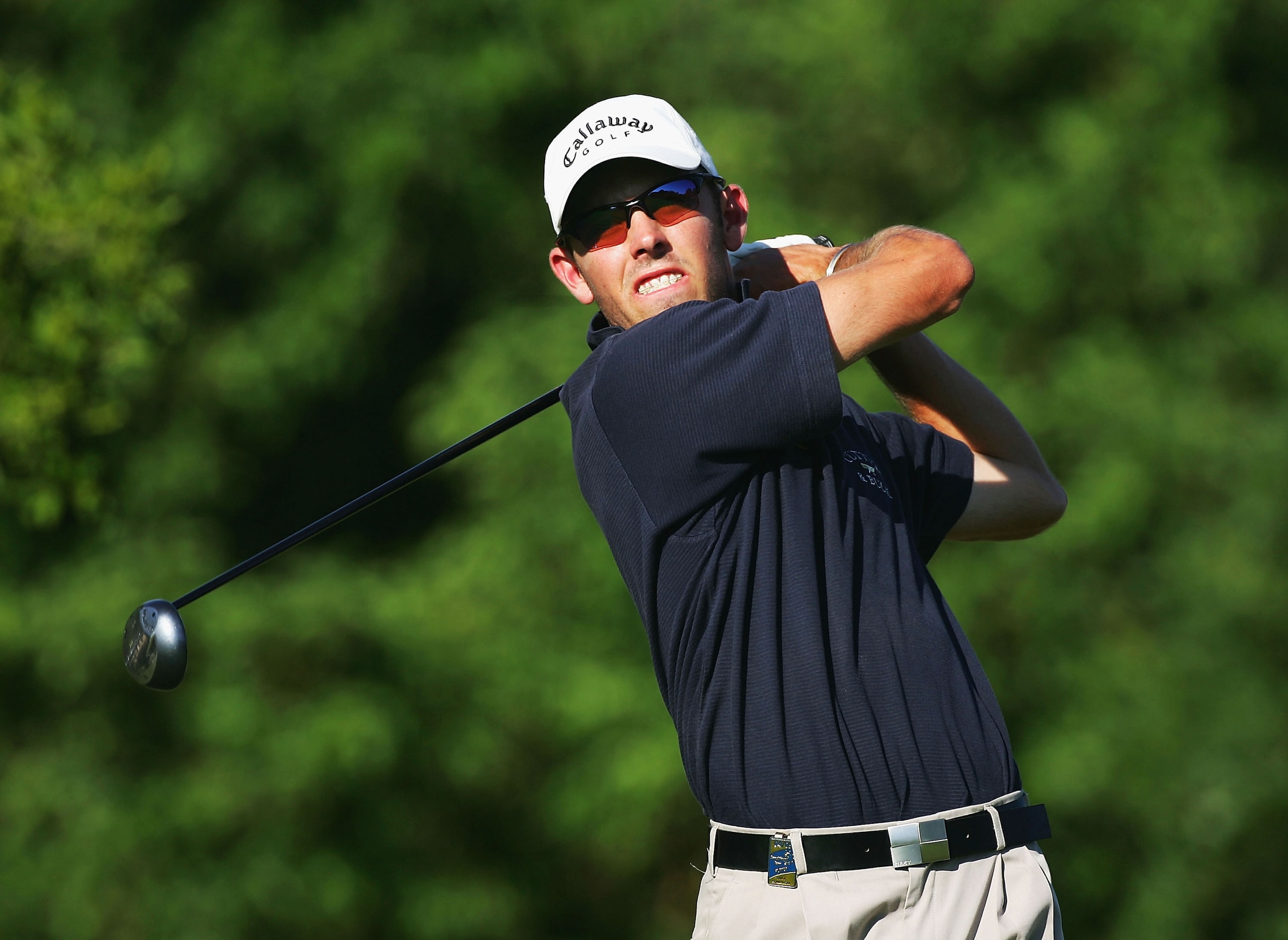 MALELANE, SOUTH AFRICA - DECEMBER 10: Charl Schwartel of South Africa plays his tee shot on the 17th hole during the second round of The Dunhill Golf Championships at The Leopard Creek Country Club on December 10, 2004 in Malelane, South Africa. (Photo b MALELANE, SOUTH AFRICA - DECEMBER 10: Charl Schwartel of South Africa plays his tee shot on the 17th hole during the second round of The Dunhill Golf Championships at The Leopard Creek Country Club on December 10, 2004 in Malelane, South Africa. (Photo b