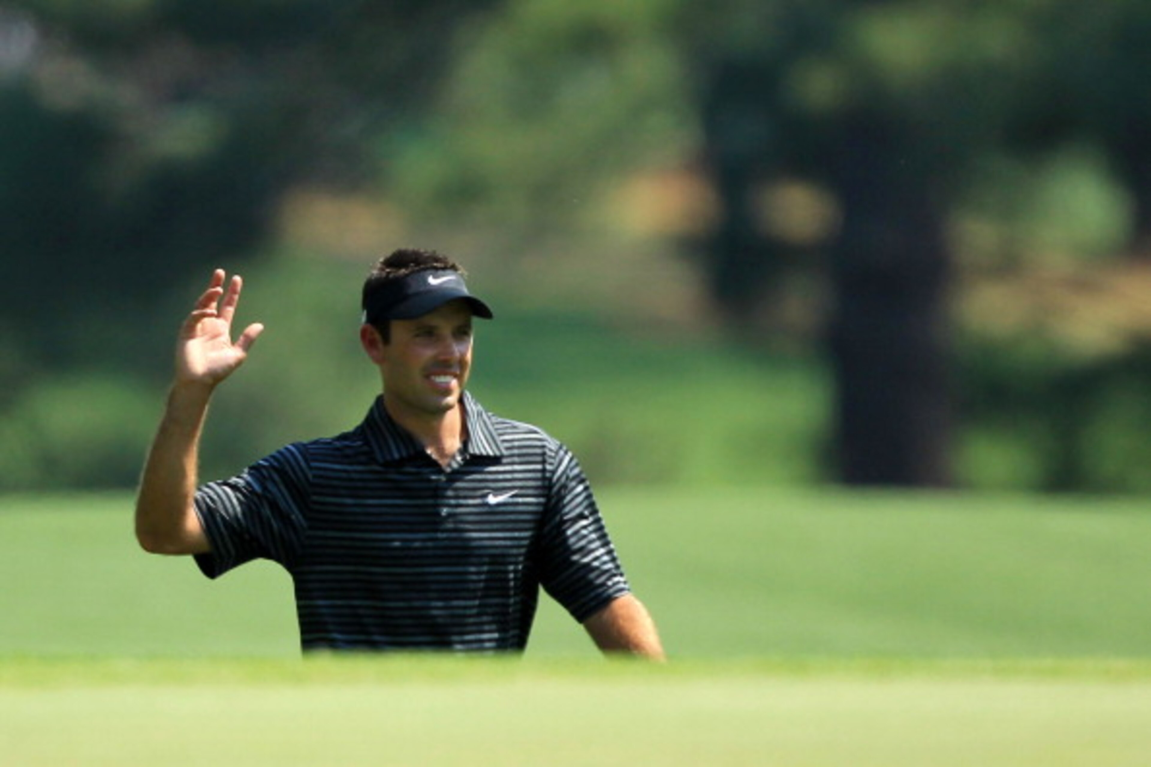 AUGUSTA, GA - APRIL 10: Charl Schwartzel of South Africa waves to the gallery after holing a shot for eagle on the third green during the final round of the 2011 Masters Tournament on April 10, 2011 in Augusta, Georgia. (Photo by David Cannon/Getty Imag AUGUSTA, GA - APRIL 10: Charl Schwartzel of South Africa waves to the gallery after holing a shot for eagle on the third green during the final round of the 2011 Masters Tournament on April 10, 2011 in Augusta, Georgia. (Photo by David Cannon/Getty Imag