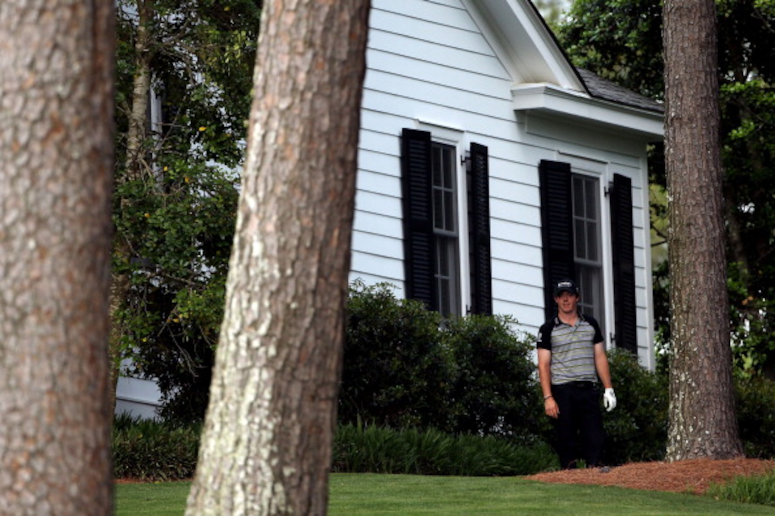 AUGUSTA, GA - APRIL 10: Rory McIlroy of Northern Ireland waits on the tenth hole after an errant tee shot during the final round of the 2011 Masters Tournament at Augusta National Golf Club on April 10, 2011 in Augusta, Georgia. (Photo by Andrew Redingt AUGUSTA, GA - APRIL 10: Rory McIlroy of Northern Ireland waits on the tenth hole after an errant tee shot during the final round of the 2011 Masters Tournament at Augusta National Golf Club on April 10, 2011 in Augusta, Georgia. (Photo by Andrew Redingt
