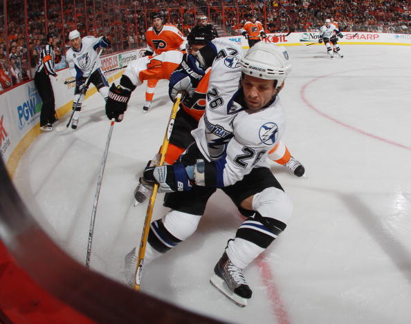 PHILADELPHIA - OCTOBER 14: Martin St. Louis #26  of the Tampa Bay Lightning carries the puck against  the Philadelphia Flyers at the Wells Fargo Center on October 14, 2010 in Philadelphia, Pennsylvania.  (Photo by Bruce Bennett/Getty Images)