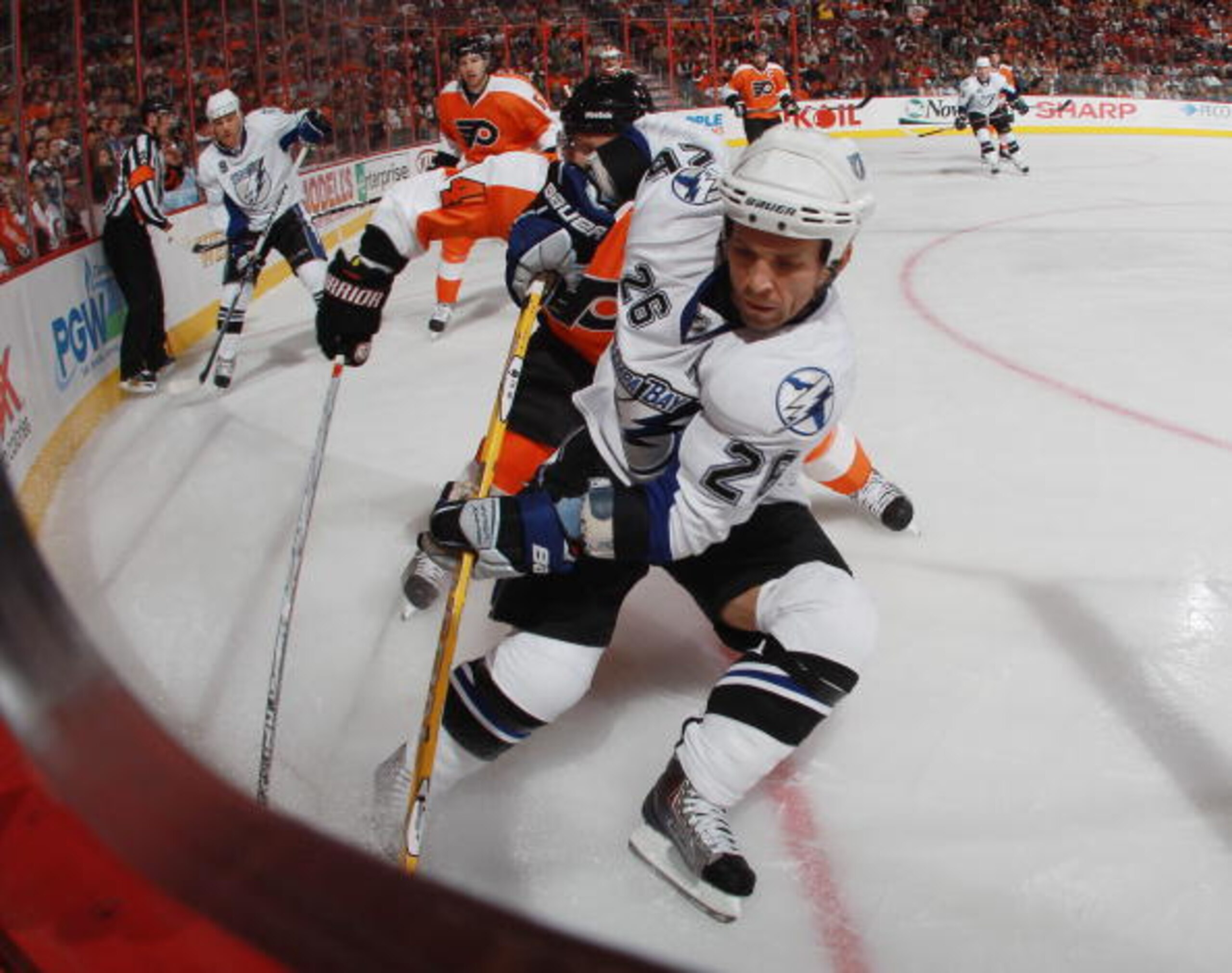 PHILADELPHIA - OCTOBER 14: Martin St. Louis #26 of the Tampa Bay Lightning carries the puck against the Philadelphia Flyers at the Wells Fargo Center on October 14, 2010 in Philadelphia, Pennsylvania. (Photo by Bruce Bennett/Getty Images) PHILADELPHIA - OCTOBER 14: Martin St. Louis #26 of the Tampa Bay Lightning carries the puck against the Philadelphia Flyers at the Wells Fargo Center on October 14, 2010 in Philadelphia, Pennsylvania. (Photo by Bruce Bennett/Getty Images)
