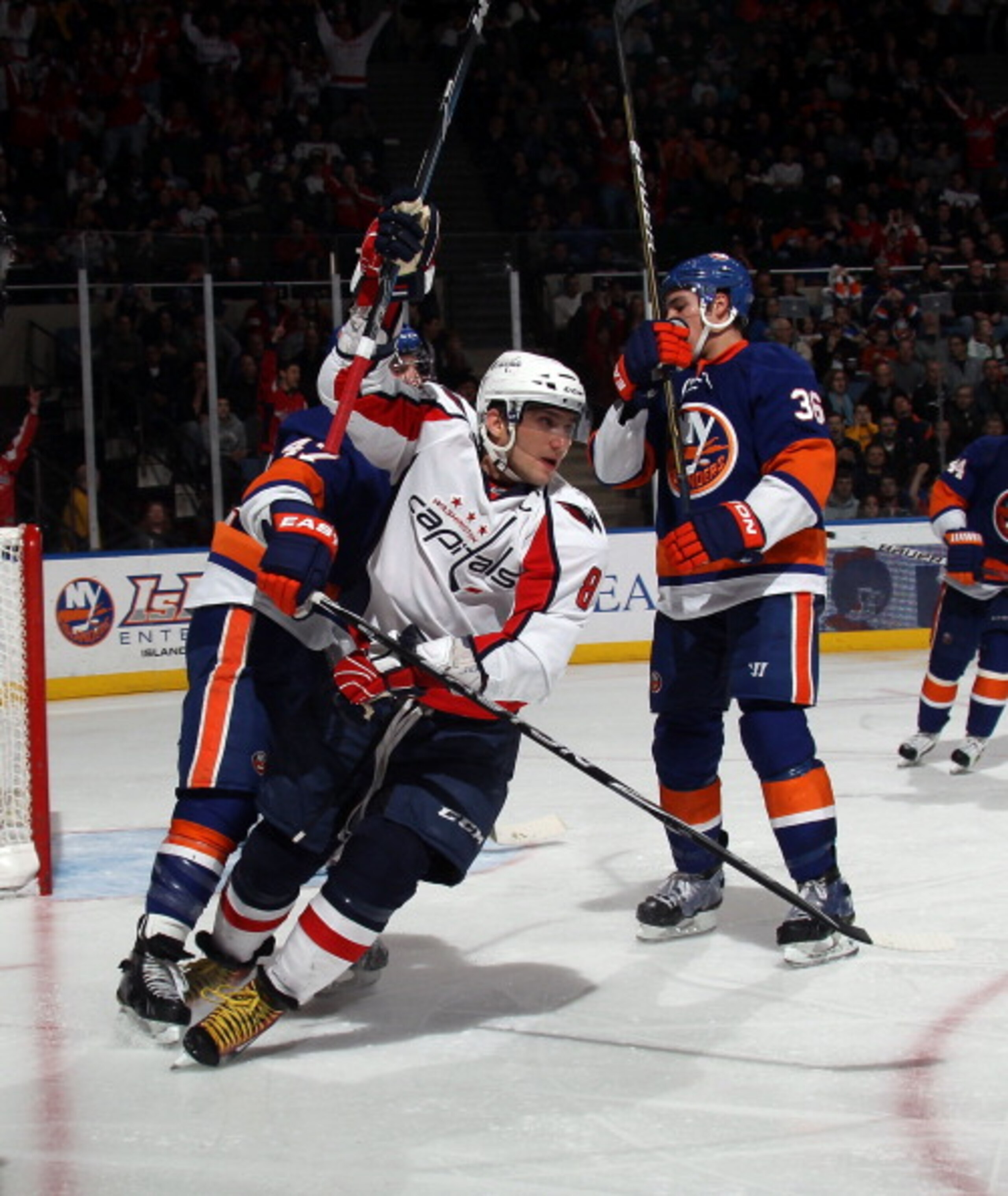 UNIONDALE, NY - FEBRUARY 26: Alex Ovechkin #8 of the Washington Capitals celebrates the game winning goal by Alexander Semin #28 of the Washington Capitals (not shown) at 5:41 of the third period against the New York Islanders at the Nassau Coliseum on Fe UNIONDALE, NY - FEBRUARY 26: Alex Ovechkin #8 of the Washington Capitals celebrates the game winning goal by Alexander Semin #28 of the Washington Capitals (not shown) at 5:41 of the third period against the New York Islanders at the Nassau Coliseum on Fe