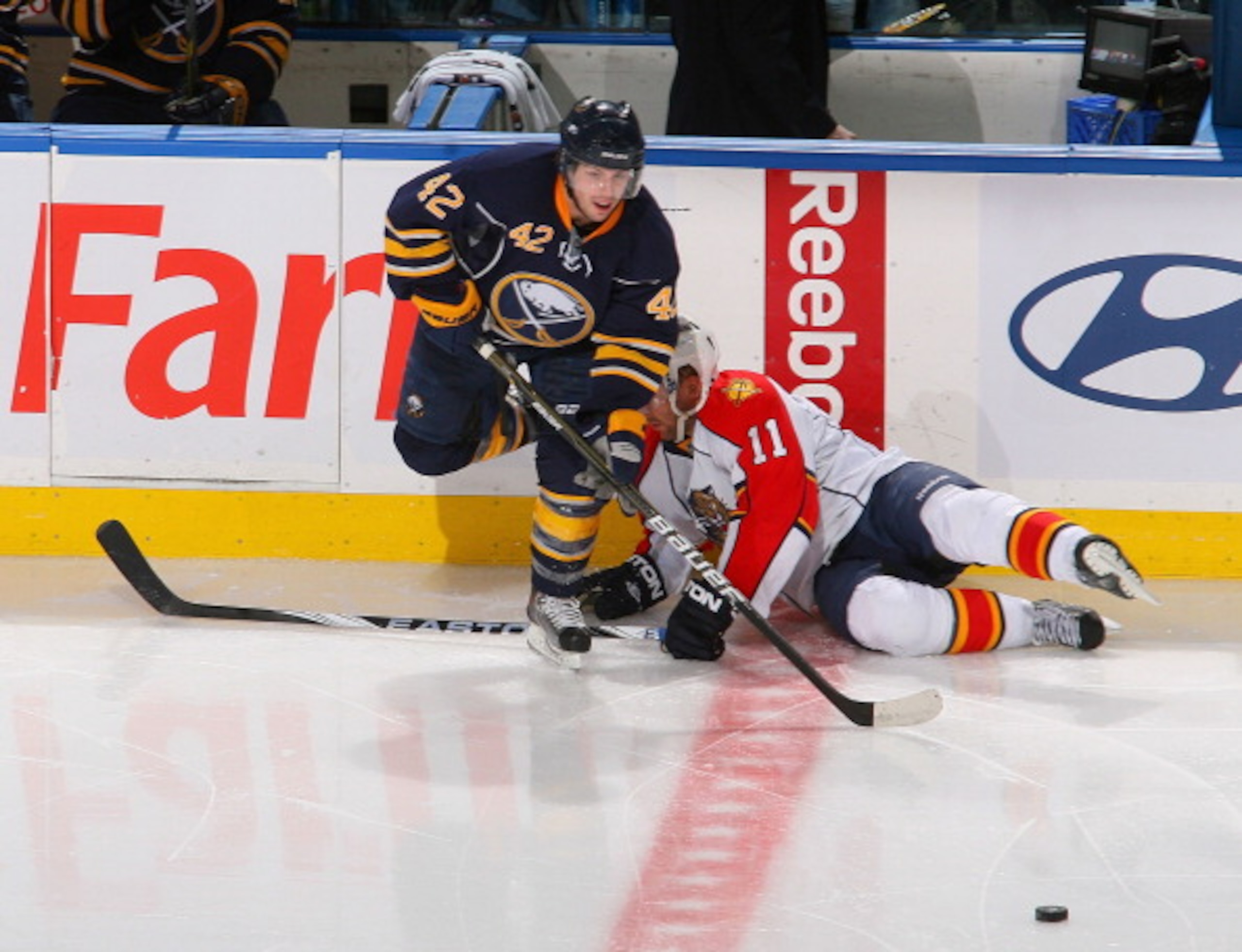 BUFFALO, NY - MARCH 25: Nathan Gerbe #42  of the Buffalo Sabres makes a pass after avoiding Niclas Bergfors #11 of the Florida Panthers at HSBC Arena on March 25, 2011 in Buffalo, New York.  (Photo by Rick Stewart/Getty Images)