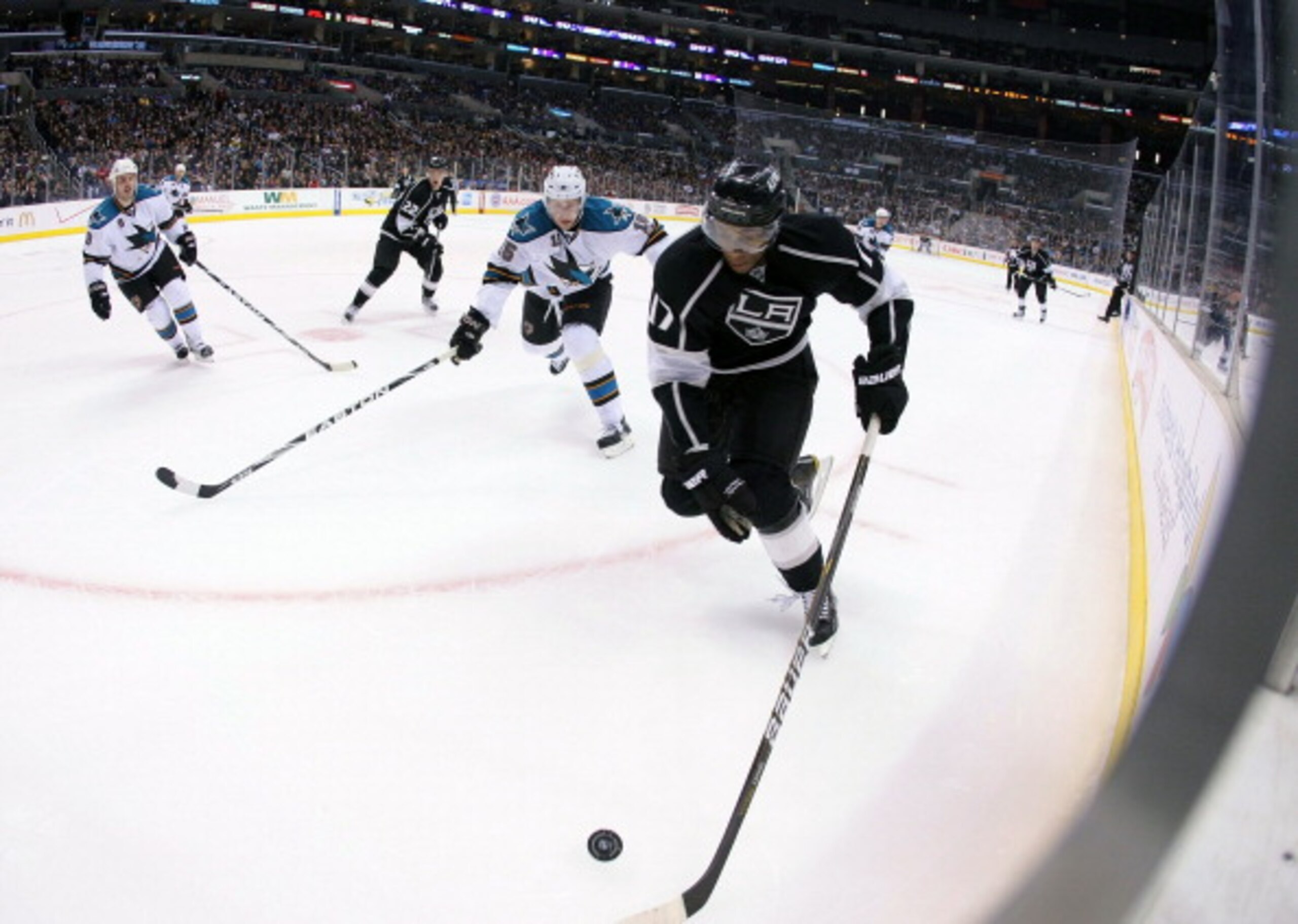 LOS ANGELES, CA - MARCH 24:  Wayne Simmonds #17 of the Los Angeles Kings plays the puck along the boards in the second period during the NHL game against the San Jose Sharks at Staples Center on March 24, 2011 in Los Angeles, California.  (Photo by Victor