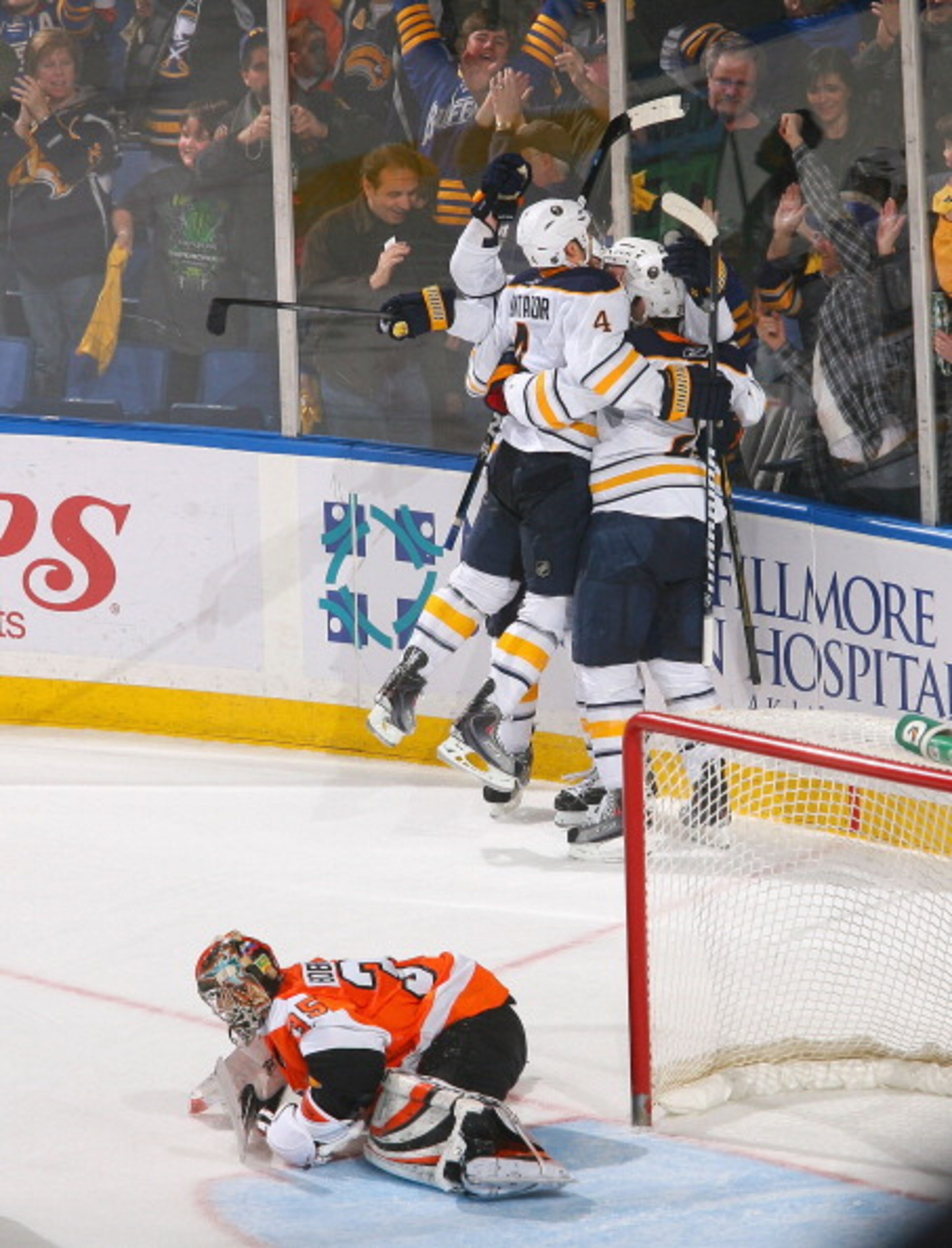 BUFFALO, NY - APRIL 08: Players from the Buffalo Sabres skate to Thomas Vanek #26 after Vanek scored the game winning goal in overtime against Sergei Bobrovsky #35 of the Philadelphia Flyers at HSBC Arena on April 8, 2011 in Buffalo, New York. Buffalo wo BUFFALO, NY - APRIL 08: Players from the Buffalo Sabres skate to Thomas Vanek #26 after Vanek scored the game winning goal in overtime against Sergei Bobrovsky #35 of the Philadelphia Flyers at HSBC Arena on April 8, 2011 in Buffalo, New York. Buffalo wo