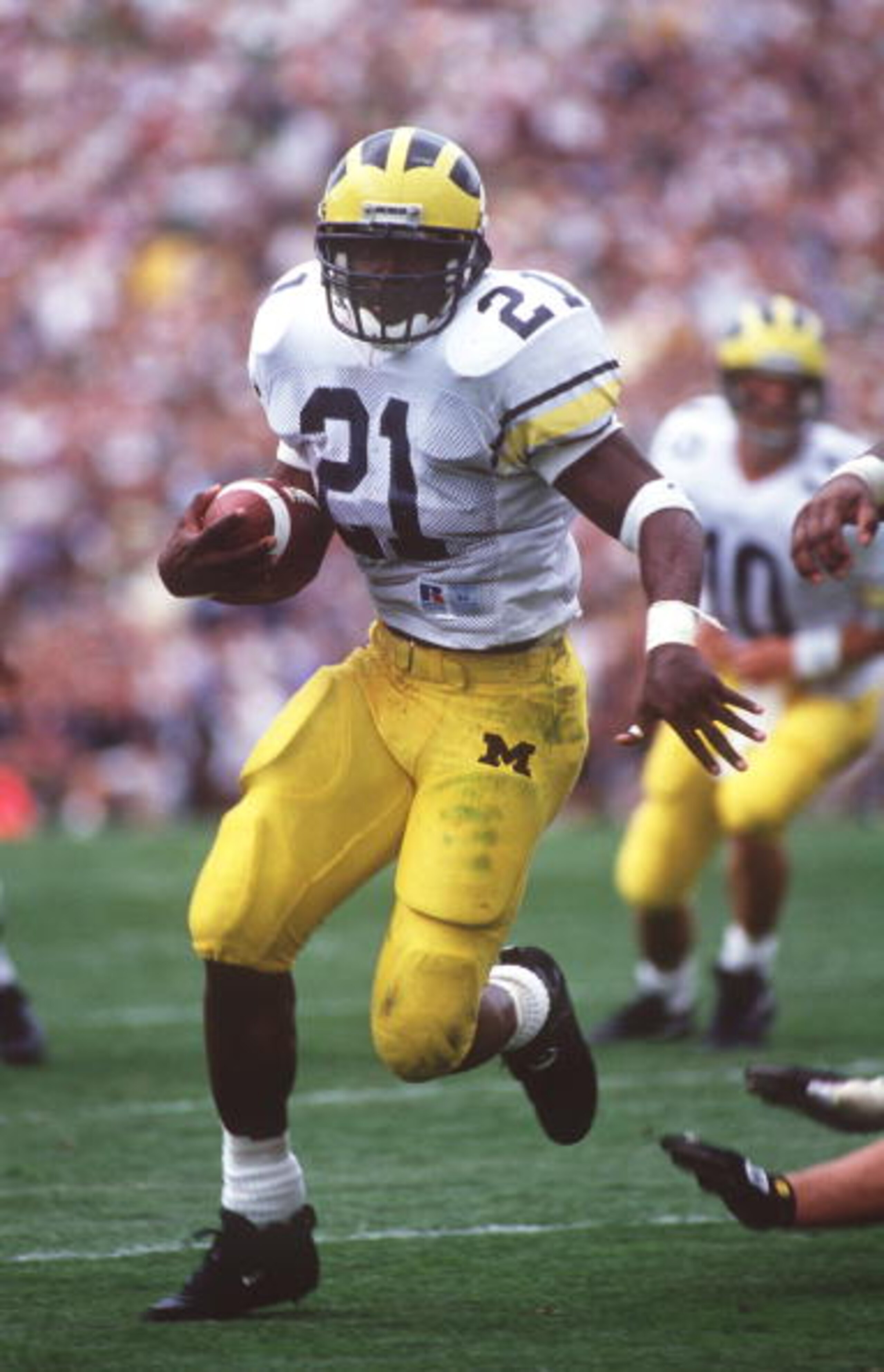 10 SEP 1994:  MICHIGAN RUNNING BACK TIM BIAKABUTUKA CARRIES THE FOOTBALL DURING THE WOLVERINES 26-24 VICTORY OVER THE FIGHTING IRISH AT NOTRE DAME STADIUM IN SOUTH BEND, INDIANA. Mandatory Credit: Gary Mook/ALLSPORT