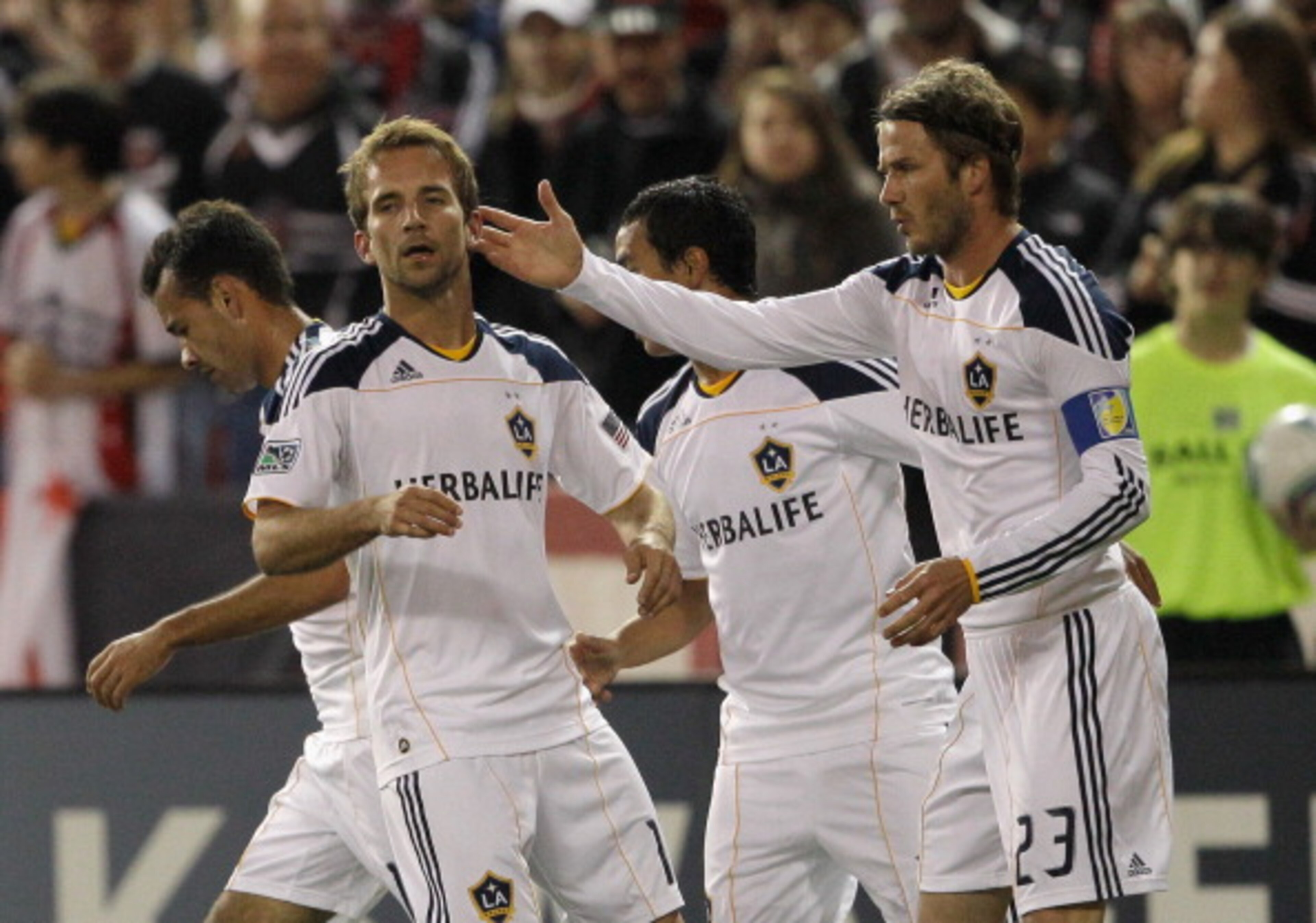 WASHINGTON, DC - APRIL 09: Mike Magee #18 of the Los Angeles Galaxy (L) is congratulated by teammate David Beckham #23 after Magee scored a goal against the D.C. United during the first half at RFK Stadium on April 9, 2011 in Washington, DC. (Photo by R WASHINGTON, DC - APRIL 09: Mike Magee #18 of the Los Angeles Galaxy (L) is congratulated by teammate David Beckham #23 after Magee scored a goal against the D.C. United during the first half at RFK Stadium on April 9, 2011 in Washington, DC. (Photo by R