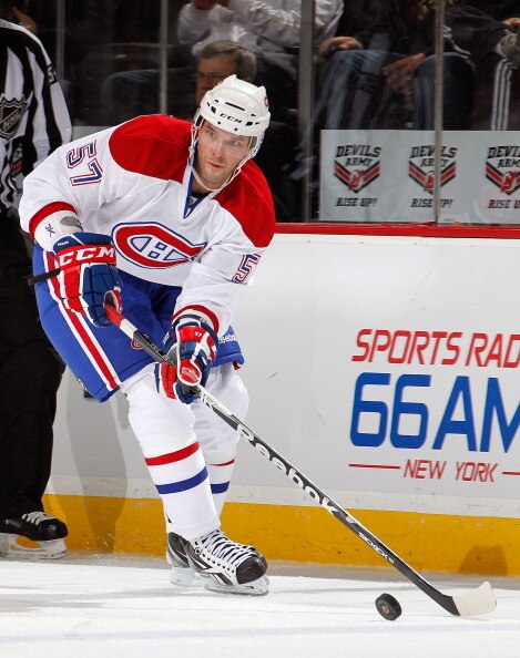 NEWARK, NJ - APRIL 02:  Benoit Pouliot #57 of the Montreal Canadians skates during an NHL hockey game against the New Jersey Devils at the Prudential Center on April 2, 2011 in Newark, New Jersey.  (Photo by Paul Bereswill/Getty Images)
