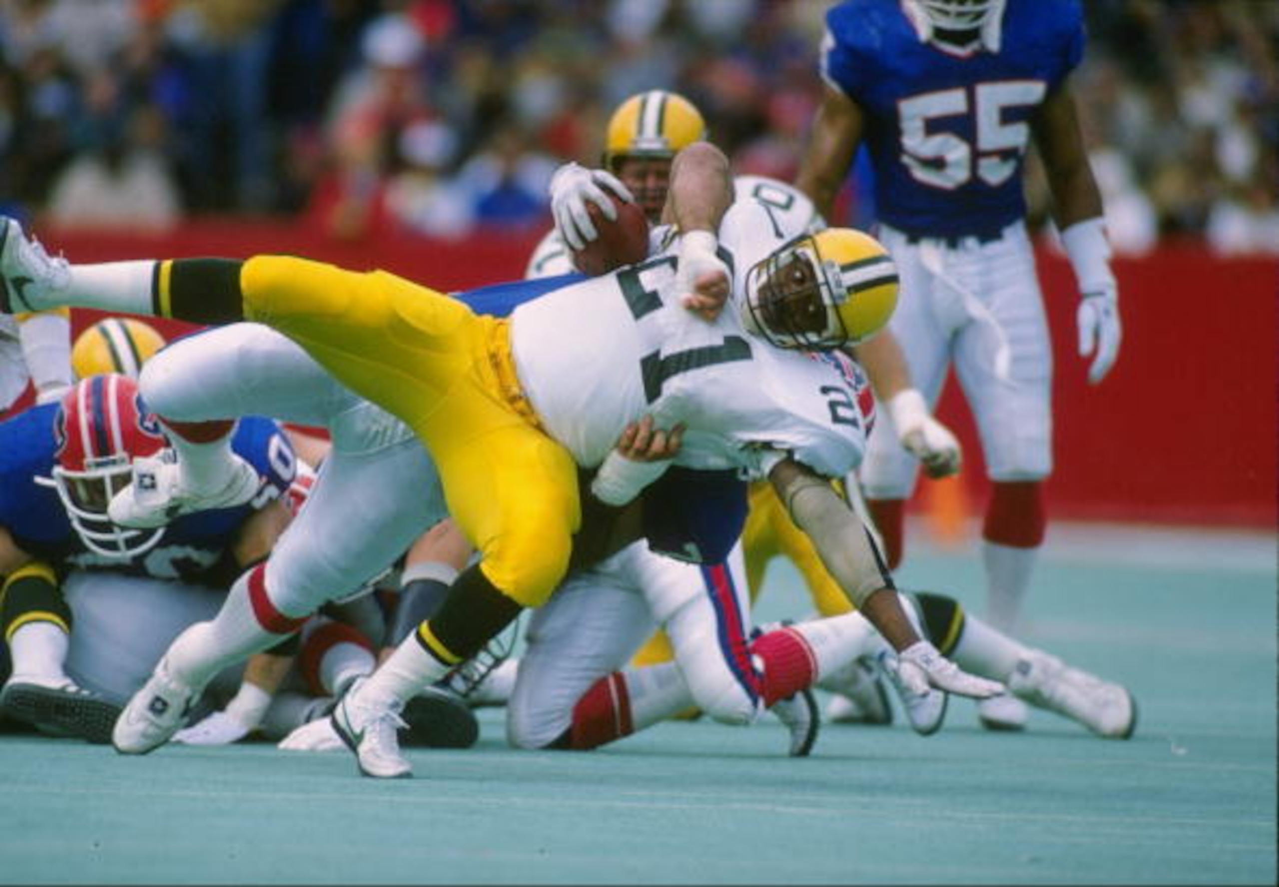 30 Oct 1988:  Running back Brent Fullwood of the Green Bay Packers gets tackled during a game against the Buffalo Bills at Rich Stadium in Orchard Park, New York.  The Bills won the game, 28-0. Mandatory Credit: Rick Stewart  /Allsport