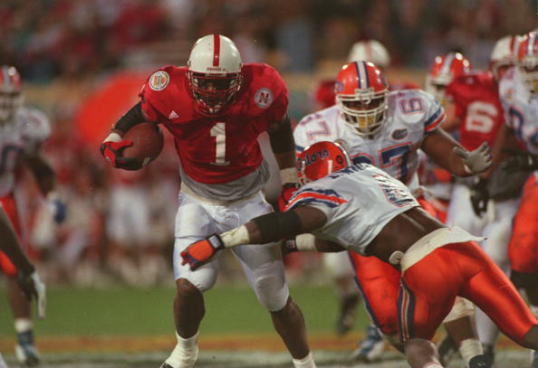 2 JAN 1996:  RUNNING BACK LAWRENCE PHILLIPS #1 OF THE NEBRASKA CORNHUSKERS BREAKS THE TACKLE OF STRONG SAFETY LAWRENCE WRIGHT OF THE FLORIDA GATORS ON HIS WAY TO A 42 YARD TOUCHDOWN DURING THE FIESTA BOWL AT SUN DEVIL STADIUM IN TEMPE, ARIZONA.   Mandator