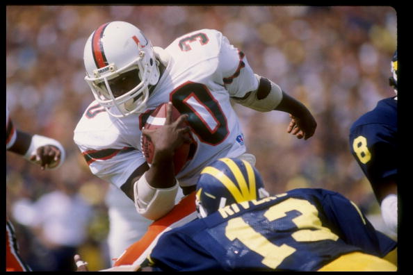 Fullback Alonzo Highsmith of the Miami Hurricanes runs with the ball during a game against the Michigan Wolverines at Michigan Stadium in Ann Arbor, Michigan.