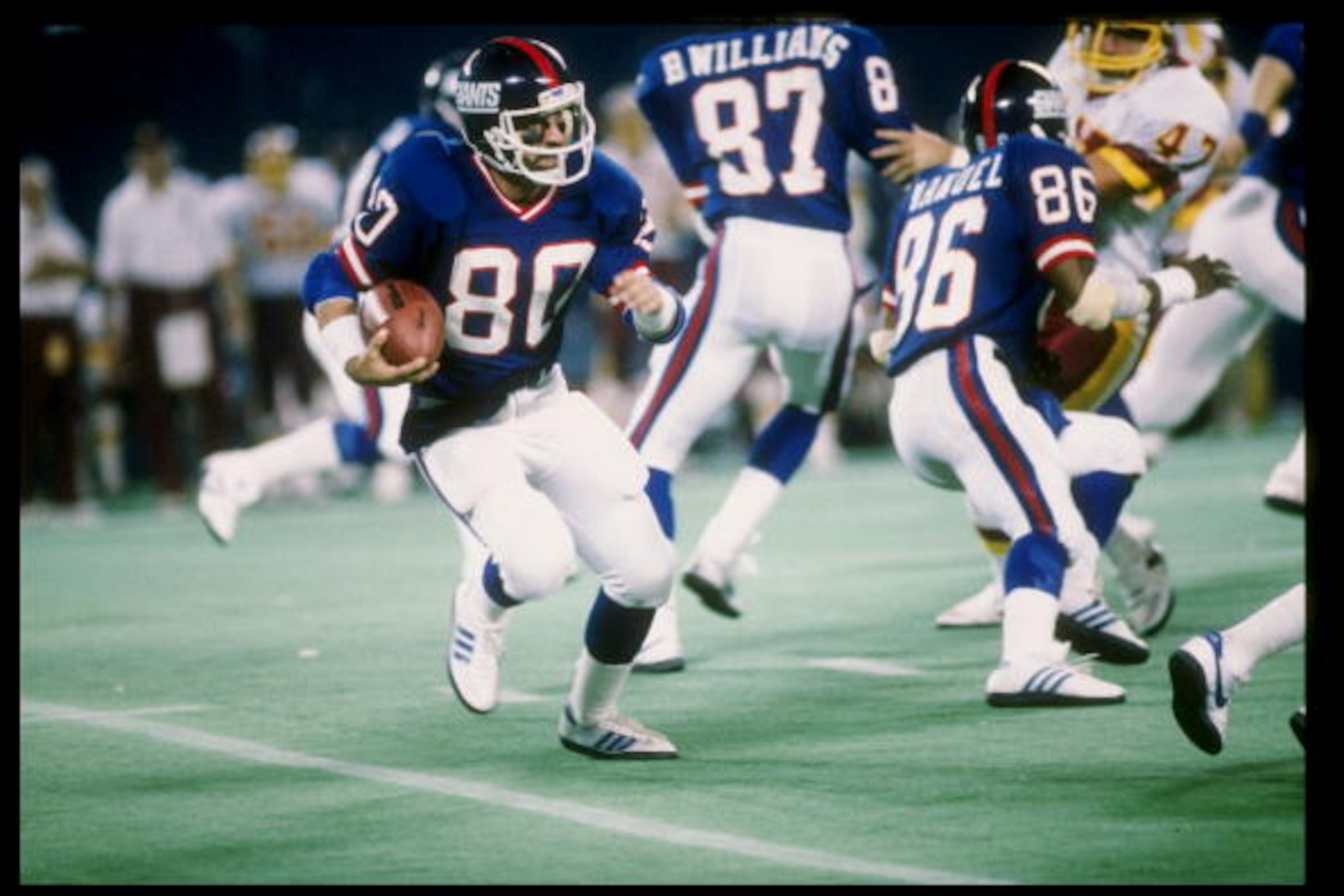 28 Oct 1984: Wide receiver Phil McConkey of the New York Giants runs with the ball during a game against the Washington Redskins in Giants Stadium at the Meadowlands in East Rutherford, New Jersey. The Giants won the game 37-13.