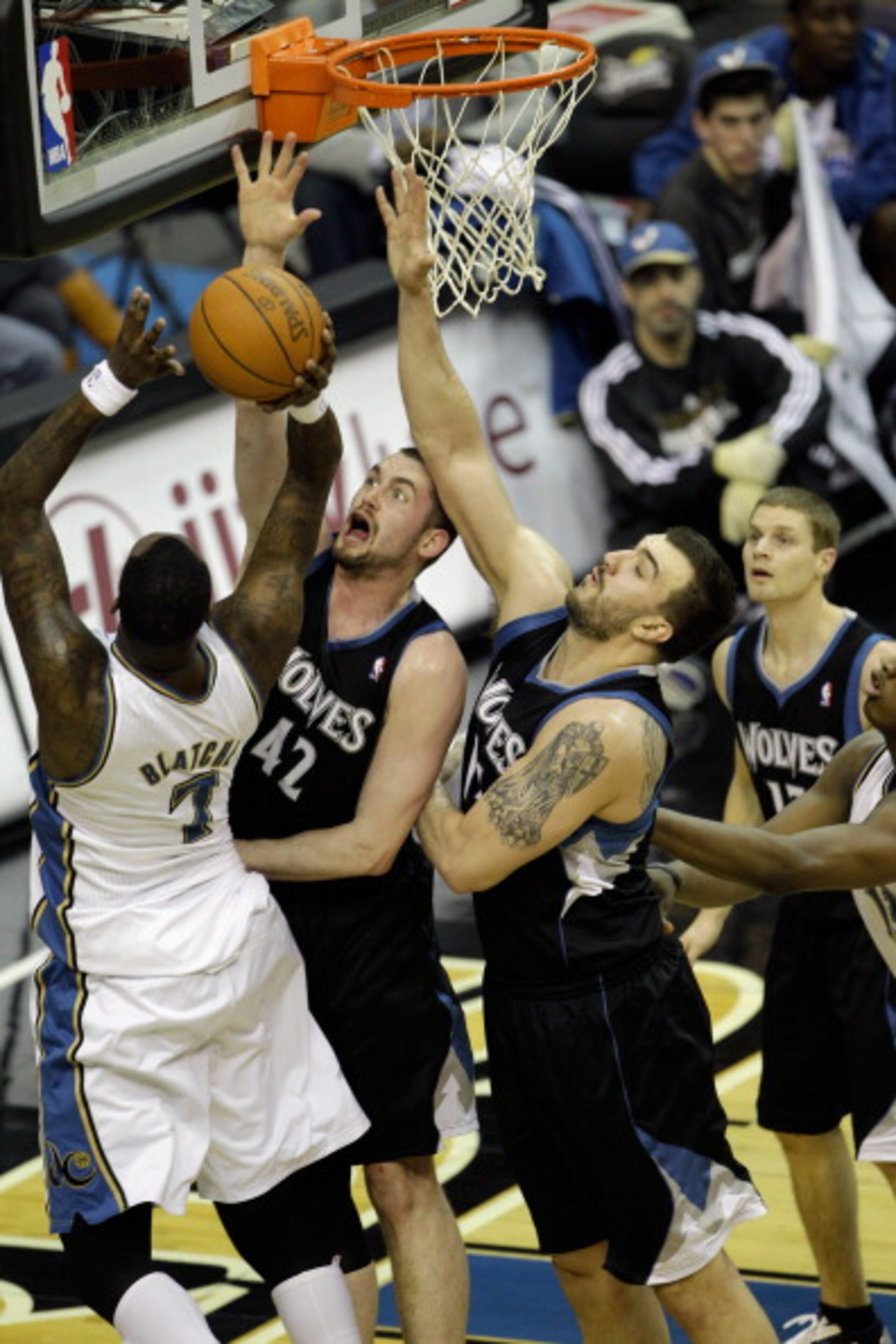 WASHINGTON, DC - MARCH 05:  Andray Blatche #7 of the Washington Wizards puts up a shot while being guarded by Kevin Love #42 and Nikola Pekovic #14 (R) of the Minnesota Timberwolves at the Verizon Center on March 5, 2011 in Washington, DC. NOTE TO USER: U