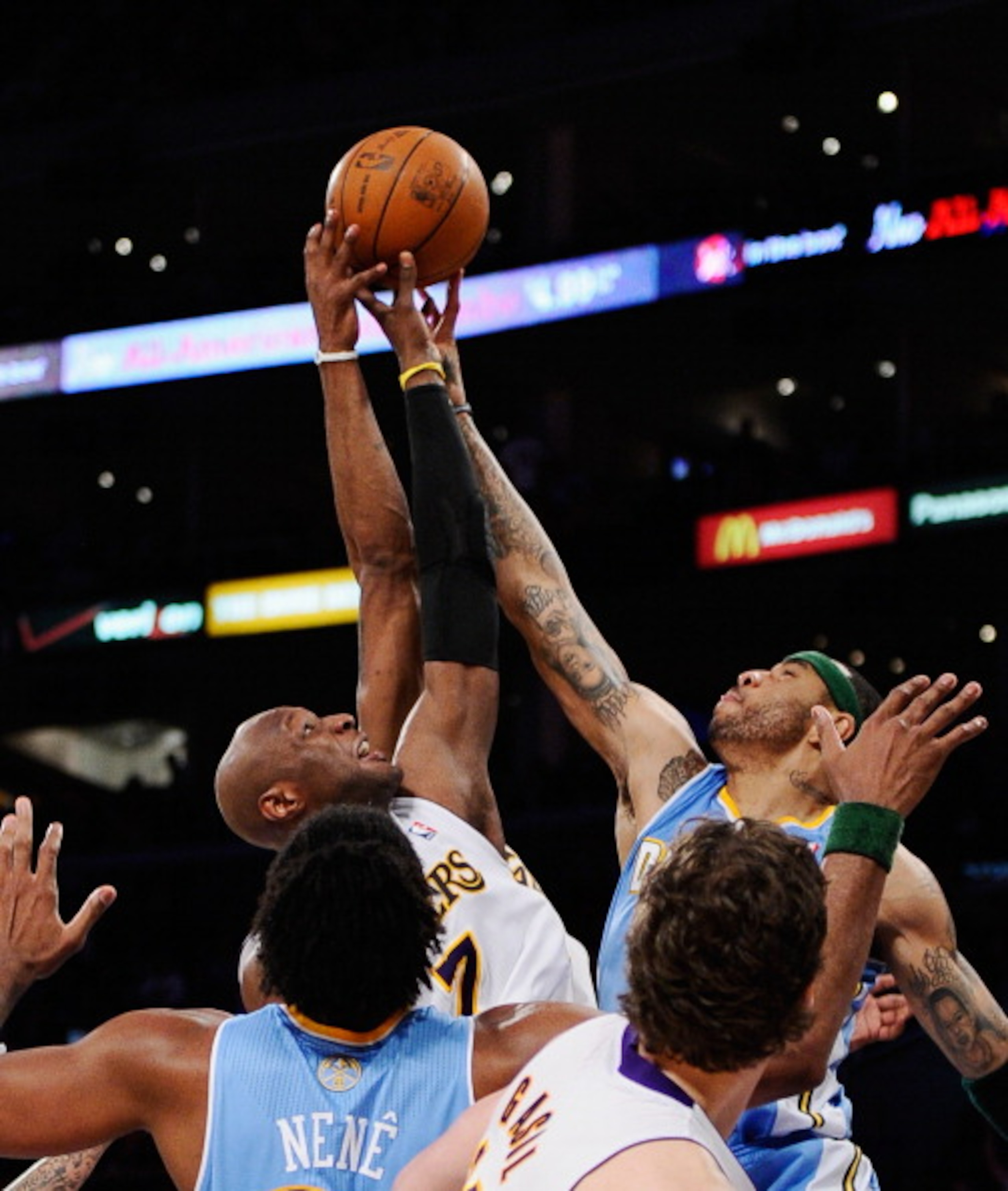 LOS ANGELES, CA - APRIL 03: Kenyon Martin #4 of the Denver Nuggets and Lamar Odom #7 of the Los Angeles Lakers battle for a rebound during the game at Staples Center on April 3, 2011 in Los Angeles, California. NOTE TO USER: User expressly acknowledges a LOS ANGELES, CA - APRIL 03: Kenyon Martin #4 of the Denver Nuggets and Lamar Odom #7 of the Los Angeles Lakers battle for a rebound during the game at Staples Center on April 3, 2011 in Los Angeles, California. NOTE TO USER: User expressly acknowledges a