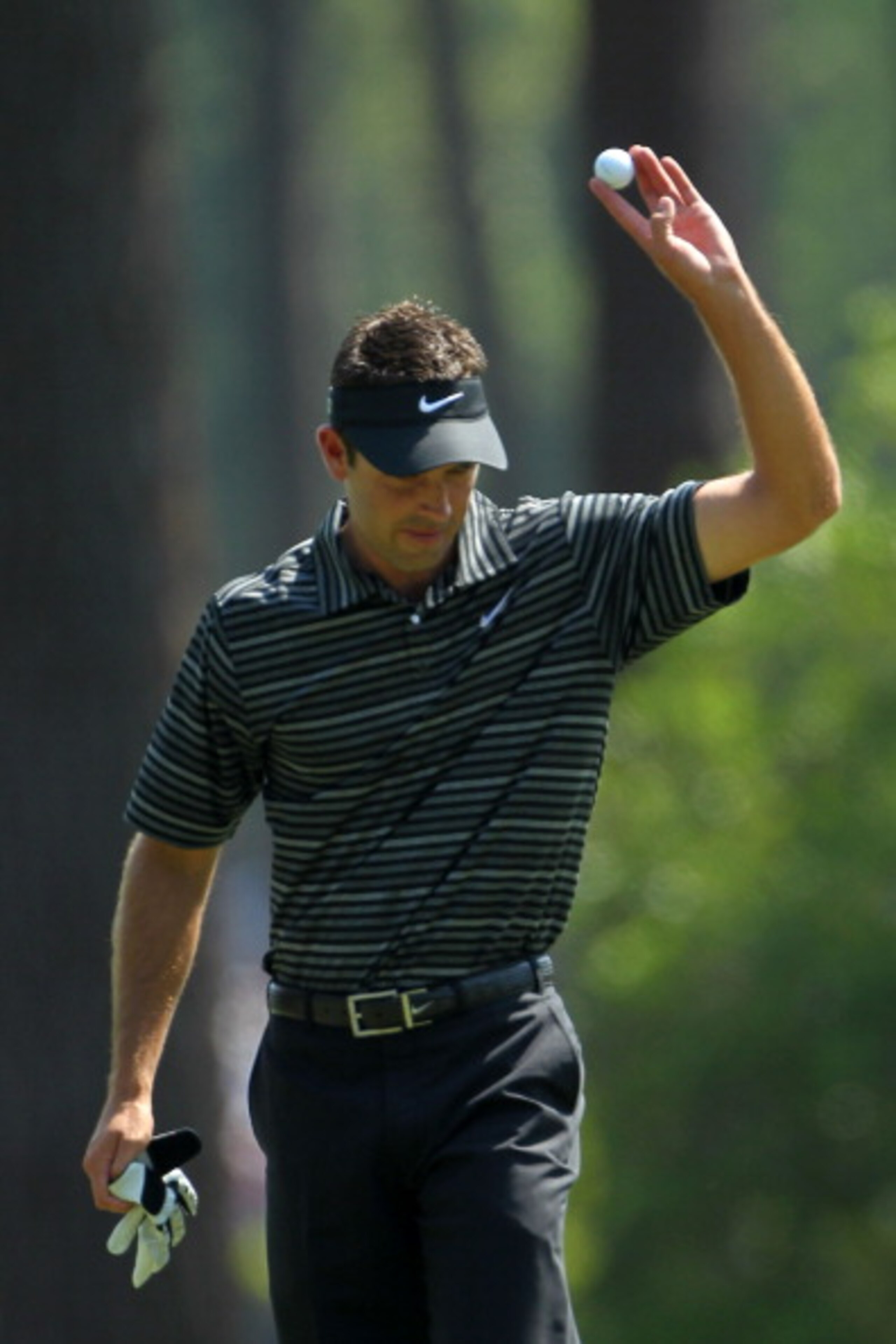 AUGUSTA, GA - APRIL 10:  Charl Schwartzel of South Africa waves to the gallery after holing a shot for eagle on the third green during the final round of the 2011 Masters Tournament on April 10, 2011 in Augusta, Georgia.  (Photo by Jamie Squire/Getty Imag
