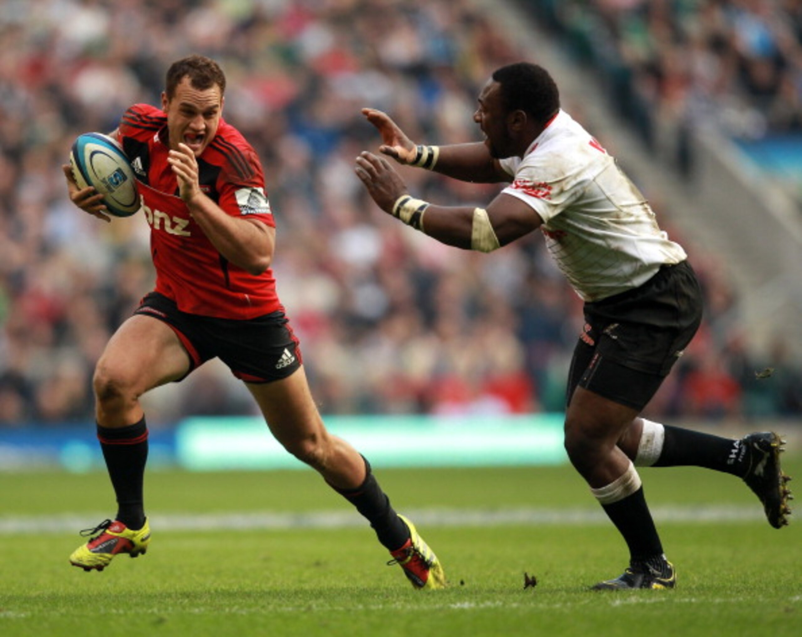 LONDON, ENGLAND - MARCH 27:  Israel Dagg (L) of the Crusaders breaks free during the round six Super Rugby match between the Crusaders and the Sharks at Twickenham Stadium on March 27, 2011 in London, United Kingdom.  (Photo by Warren Little/Getty Images)