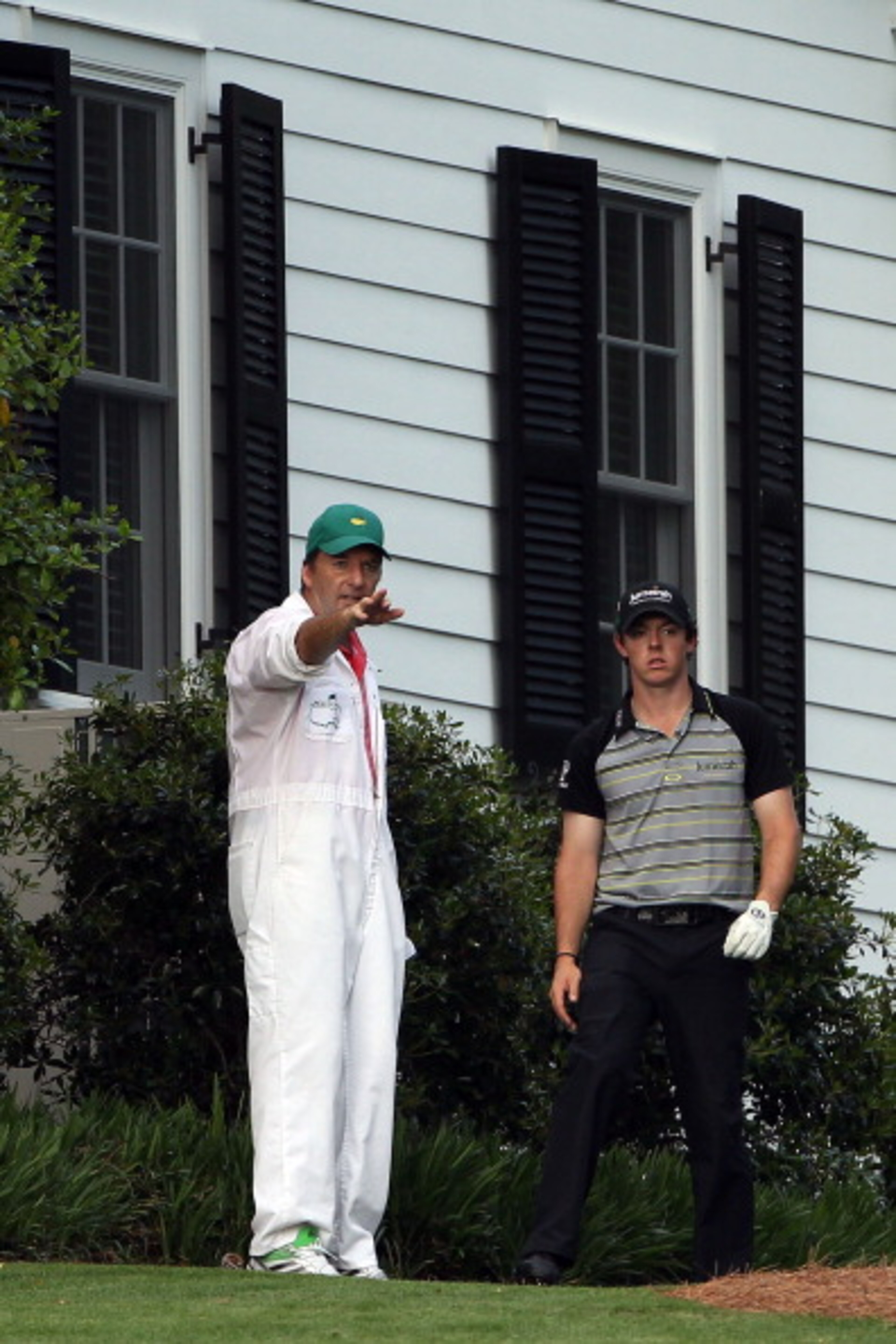 AUGUSTA, GA - APRIL 10:  Rory McIlroy of Northern Ireland waits to plays a shot on the tenth hole as his caddie J.P. Fitzgerald looks on during the final round of the 2011 Masters Tournament at Augusta National Golf Club on April 10, 2011 in Augusta, Geor