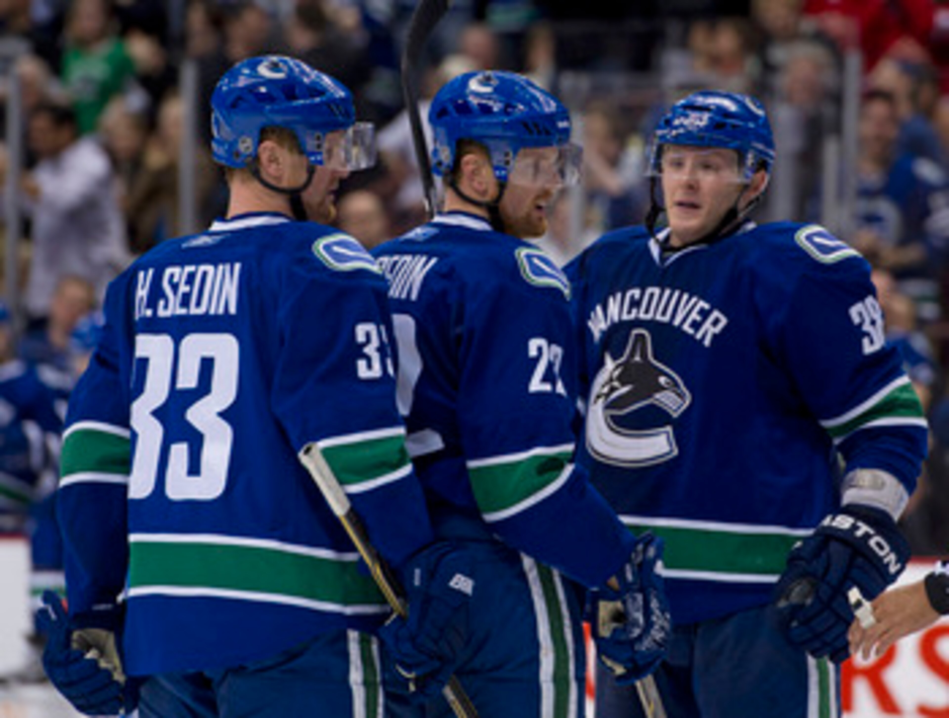 VANCOUVER, CANADA - MARCH 31: Daniel Sedin #22 of the Vancouver Canucks is congratulated by Henrik Sedin #33 and Victor Oreskovich #38 after scoring against the Los Angeles Kings during the second period in NHL action on March 31, 2011 at Rogers Arena in VANCOUVER, CANADA - MARCH 31: Daniel Sedin #22 of the Vancouver Canucks is congratulated by Henrik Sedin #33 and Victor Oreskovich #38 after scoring against the Los Angeles Kings during the second period in NHL action on March 31, 2011 at Rogers Arena in