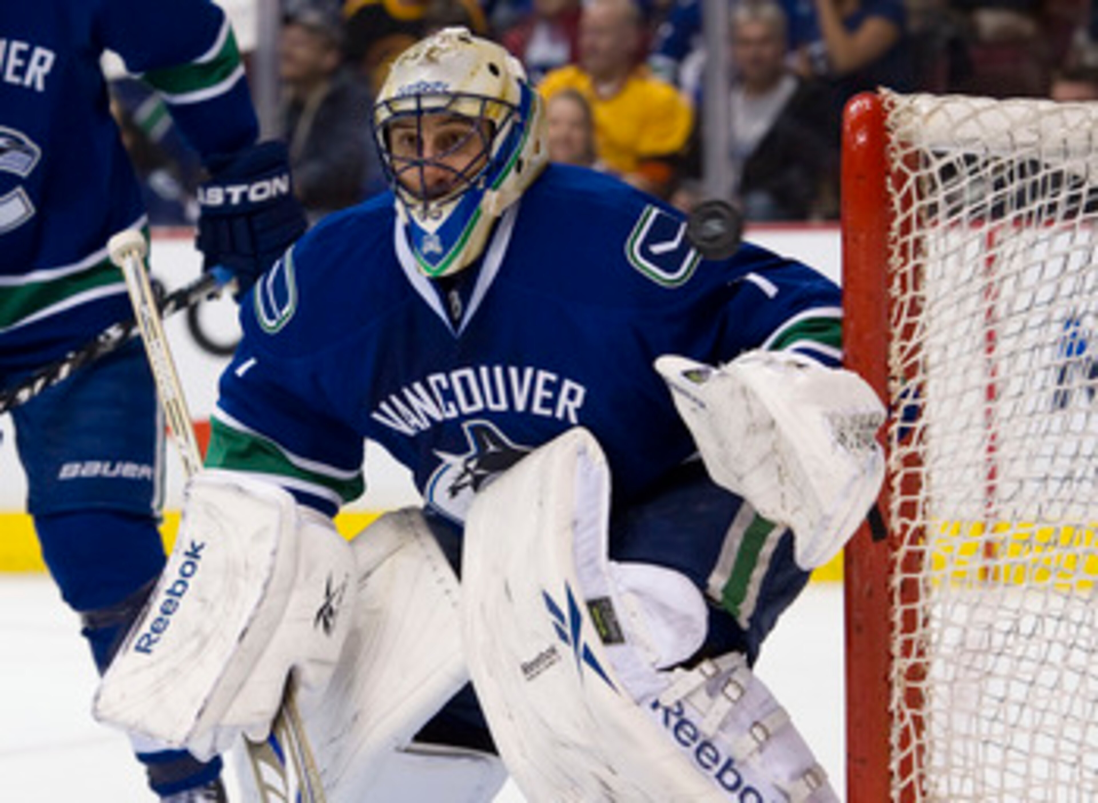 VANCOUVER, CANADA - MARCH 14: Goalie Roberto Luongo #1of the Vancouver Canucks looses sight of the puck as it flys by the net during the first period in NHL action against the Minnesota Wild on March 14, 2011 at Rogers Arena in Vancouver, British Columbia VANCOUVER, CANADA - MARCH 14: Goalie Roberto Luongo #1of the Vancouver Canucks looses sight of the puck as it flys by the net during the first period in NHL action against the Minnesota Wild on March 14, 2011 at Rogers Arena in Vancouver, British Columbia