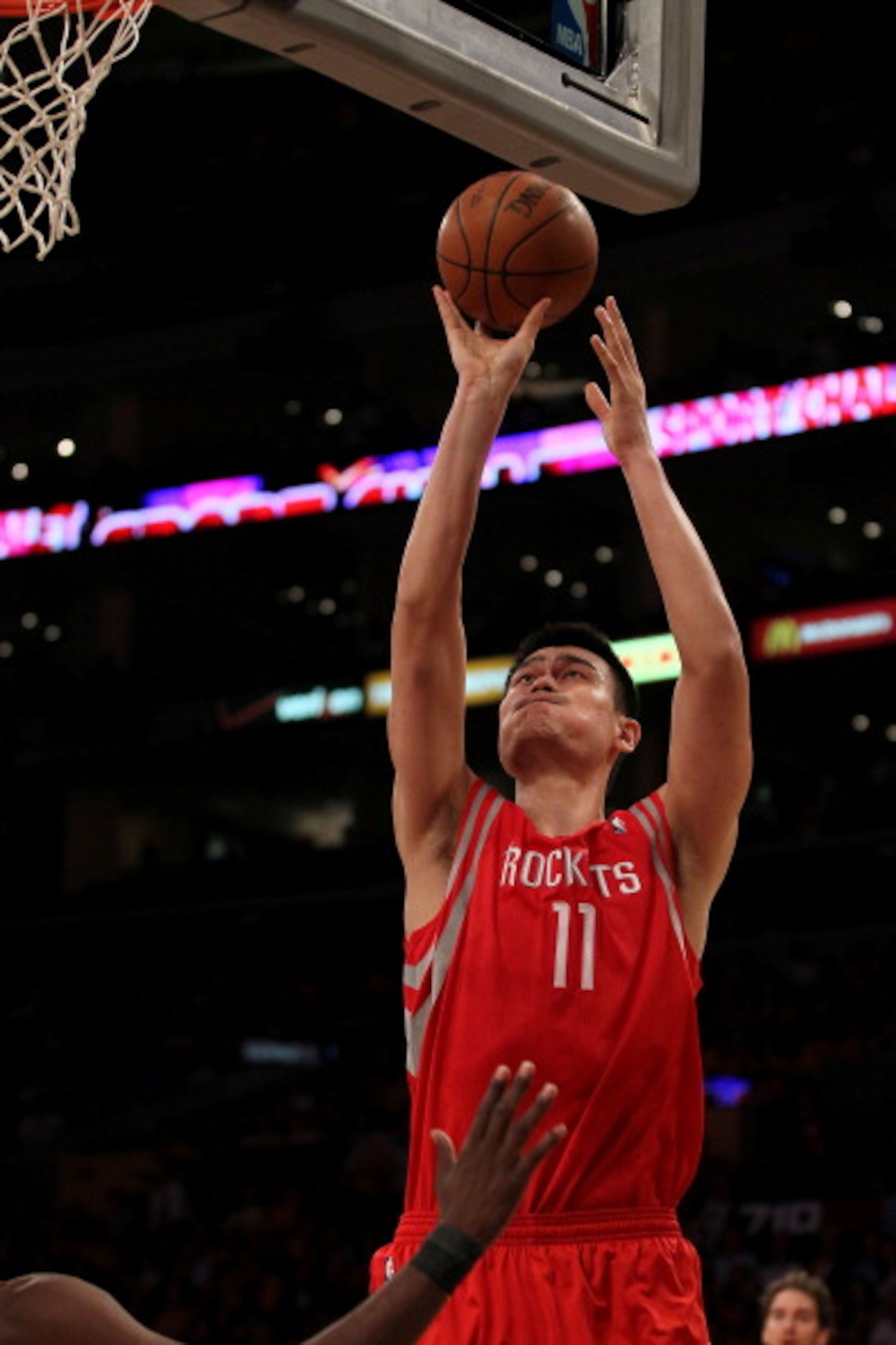 LOS ANGELES, CA - OCTOBER 26: Yao Ming #11 of the Houston Rockets takes a shot against the Los Angeles Lakers during their game at Staples Center on October 26, 2010 in Los Angeles, California. NOTE TO USER: User expressly acknowledges and agrees that, b LOS ANGELES, CA - OCTOBER 26: Yao Ming #11 of the Houston Rockets takes a shot against the Los Angeles Lakers during their game at Staples Center on October 26, 2010 in Los Angeles, California. NOTE TO USER: User expressly acknowledges and agrees that, b