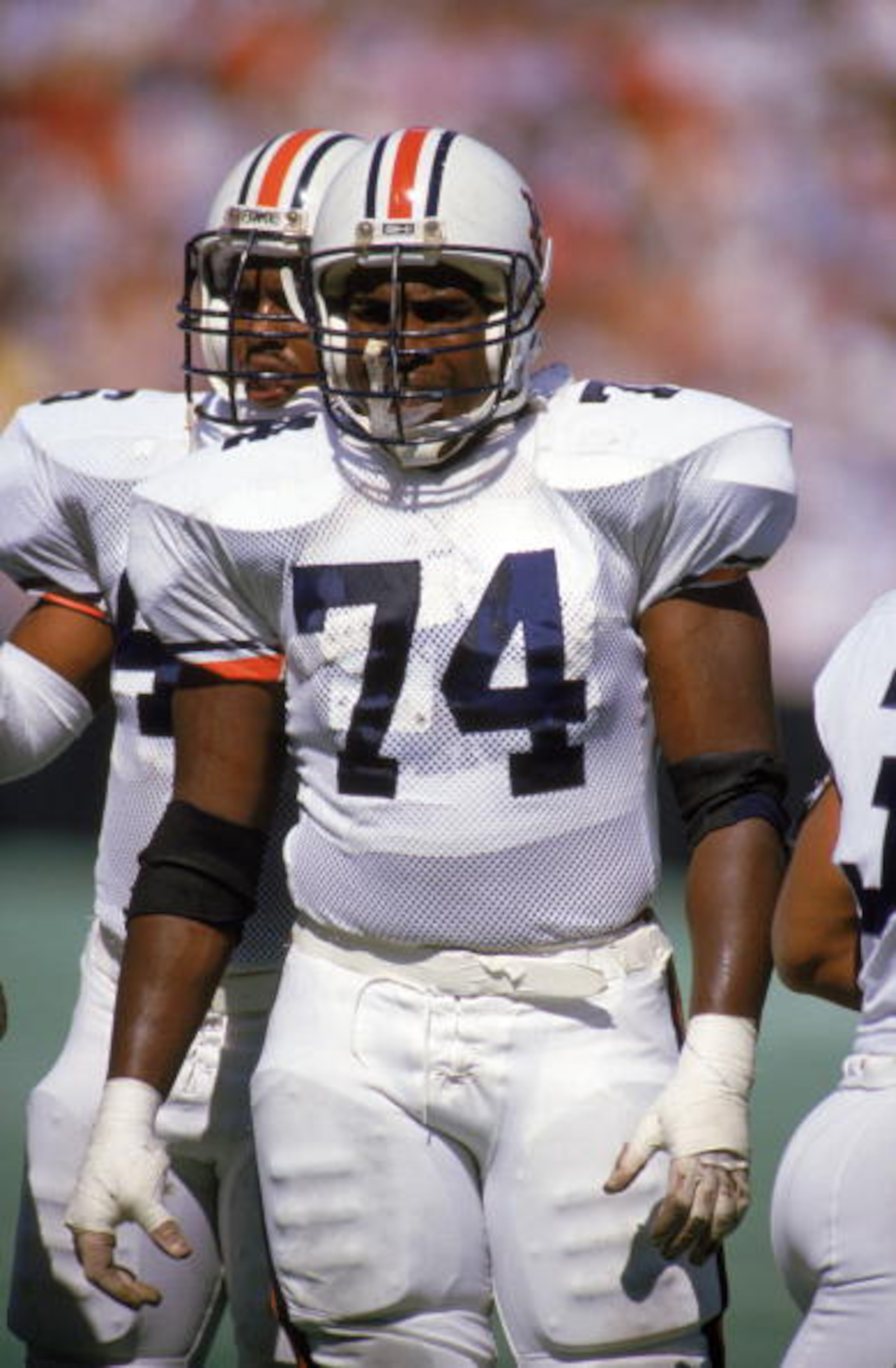 CIRCA -1988:  Tracy Rocker #74 of Auburn University stands on the field during a game against the Georgia Tech Bulldogs circa 1988. (Photo by: Allen Steele/Getty Images)