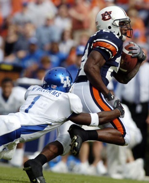 AUBURN, AL - OCTOBER 23:  Carnell Williams #24 of the Auburn Tigers is tackled by Mike Williams #1 of the Kentucky Wildcats on October 23, 2004 at Jordan-Hare stadium in Auburn, Alabama. Auburn defeated Kentucky 41-10.  (Photo by Chris Graythen/Getty Imag