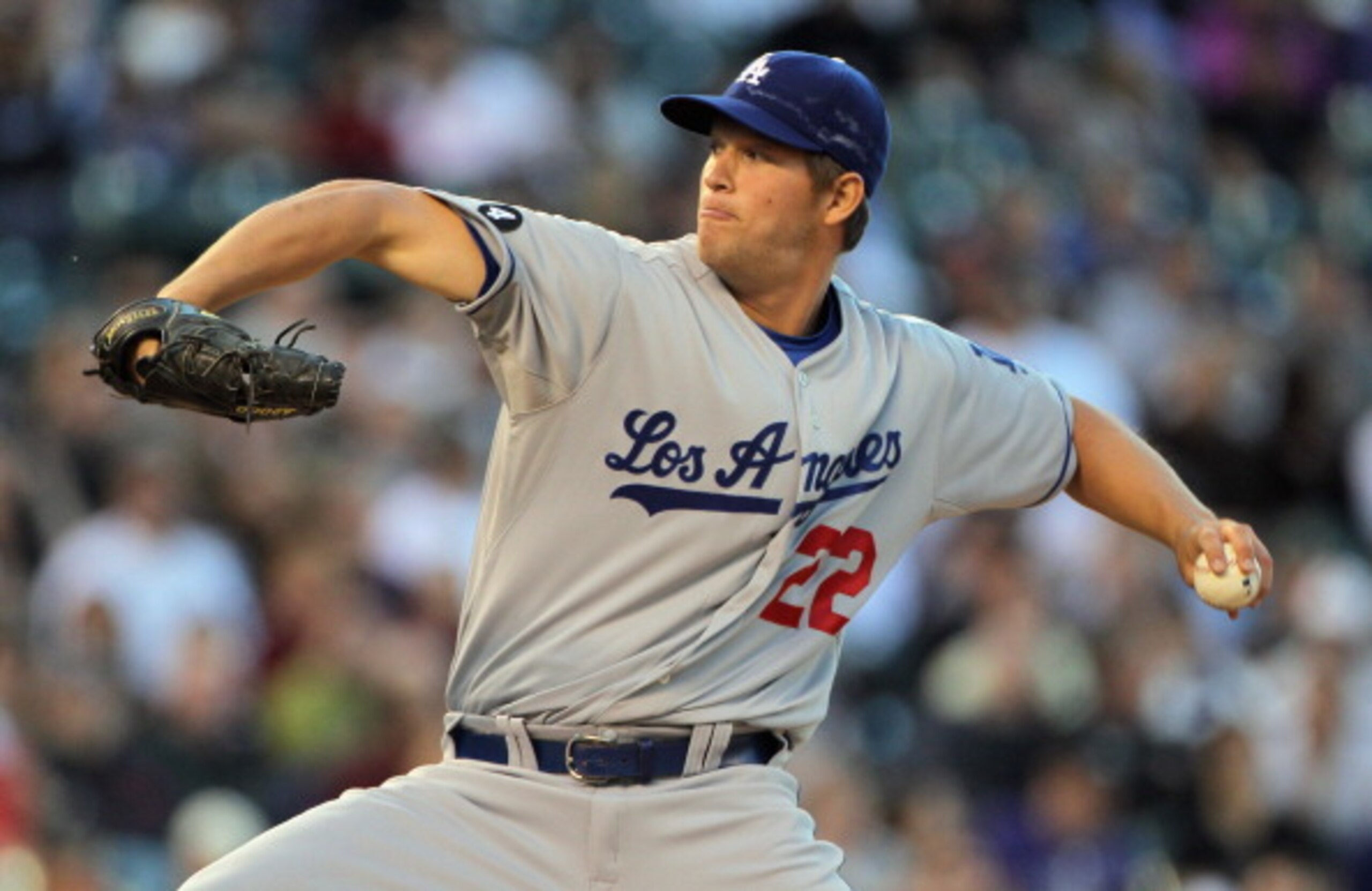 DENVER, CO - APRIL 05:  Starting pitcher Clayton Kershaw #22 of the Los Angeles Dodgers delivers against the Colorado Rockies at Coors Field on April 5, 2011 in Denver, Colorado. Kershaw collected the loss as the Rockies defeated the Dodgers 3-0.  (Photo 